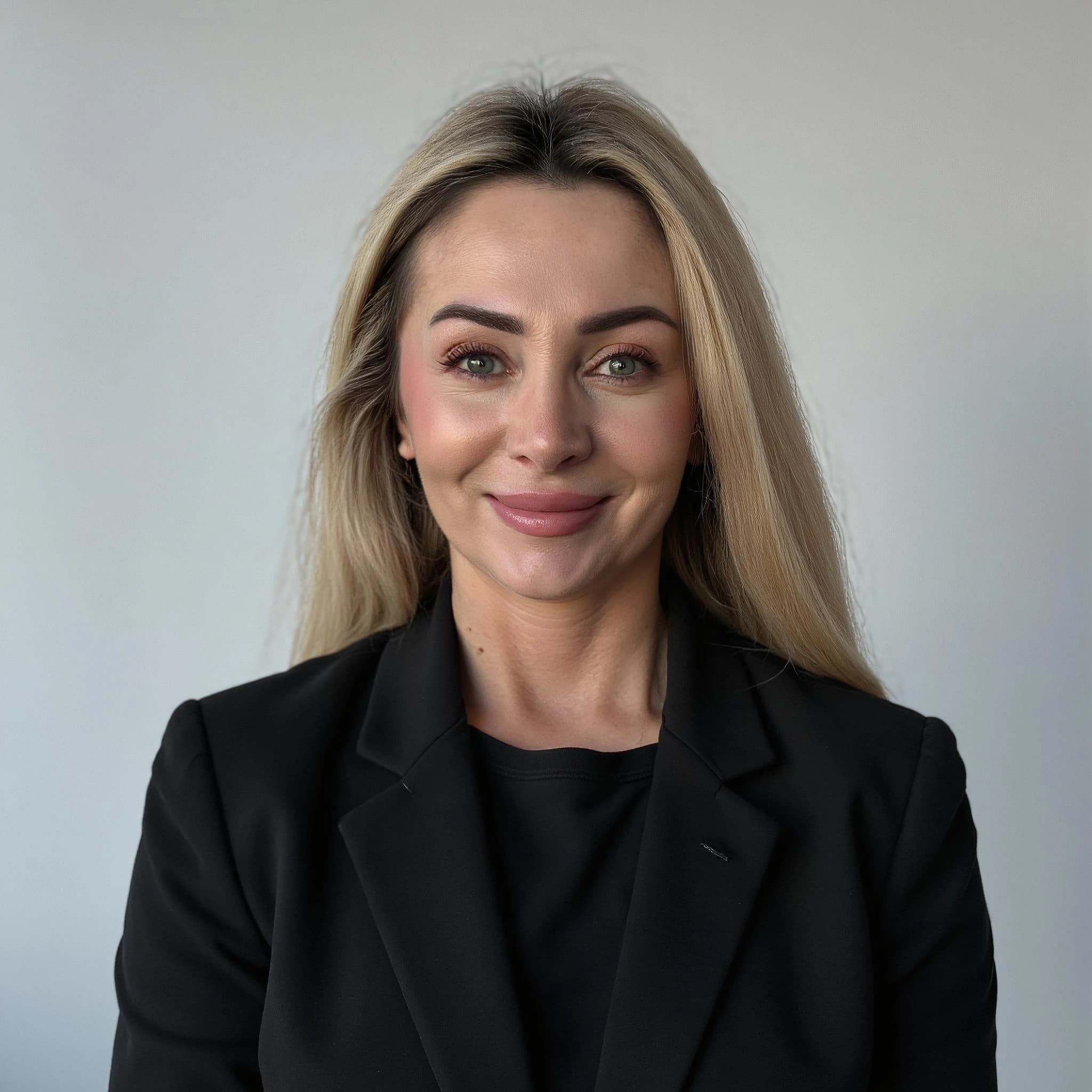 Professional headshot example: Woman Office Black Blazer Smiling 14 — LinkedInHeadshots.ai