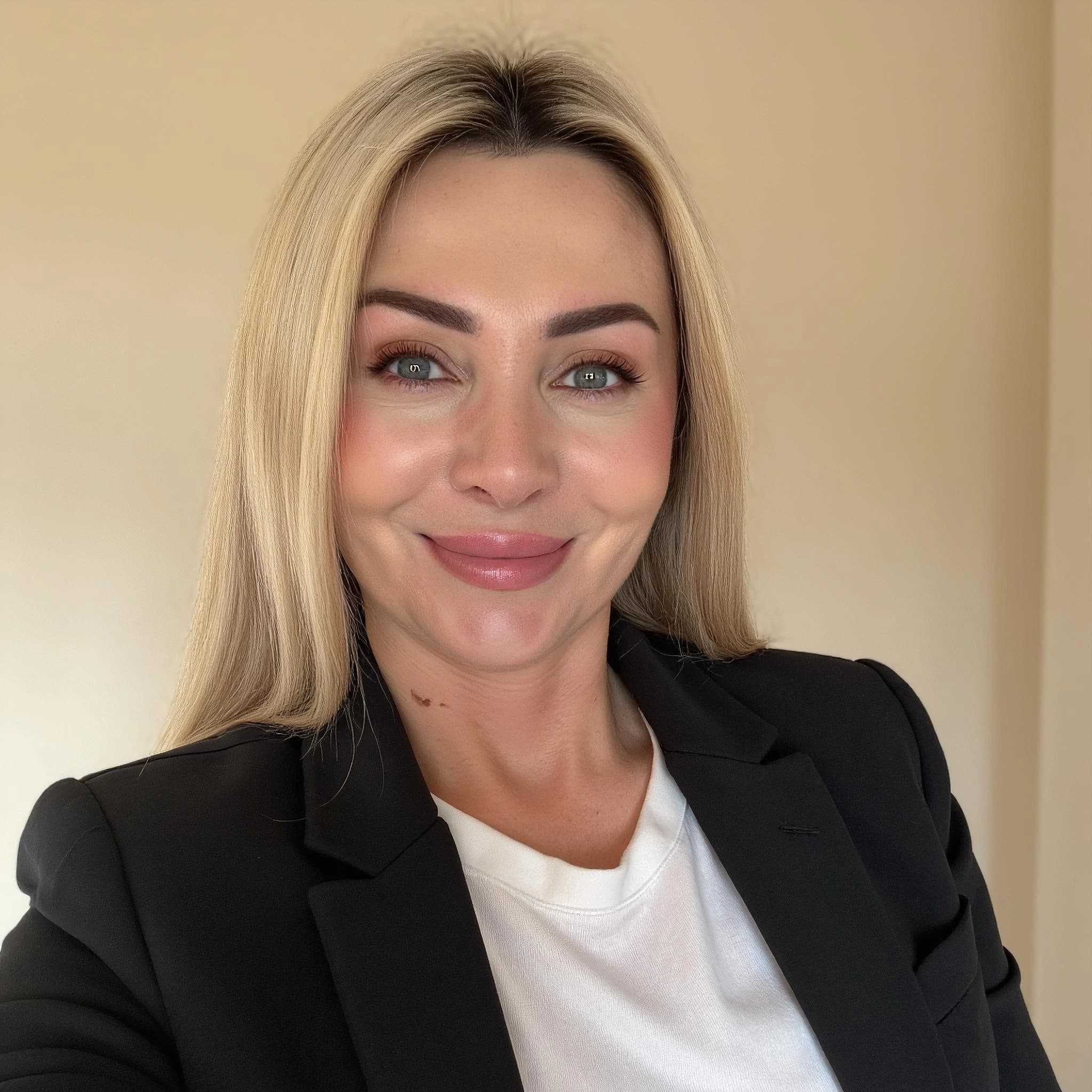 Professional headshot example: Woman Office Black Blazer Smiling 21 — LinkedInHeadshots.ai