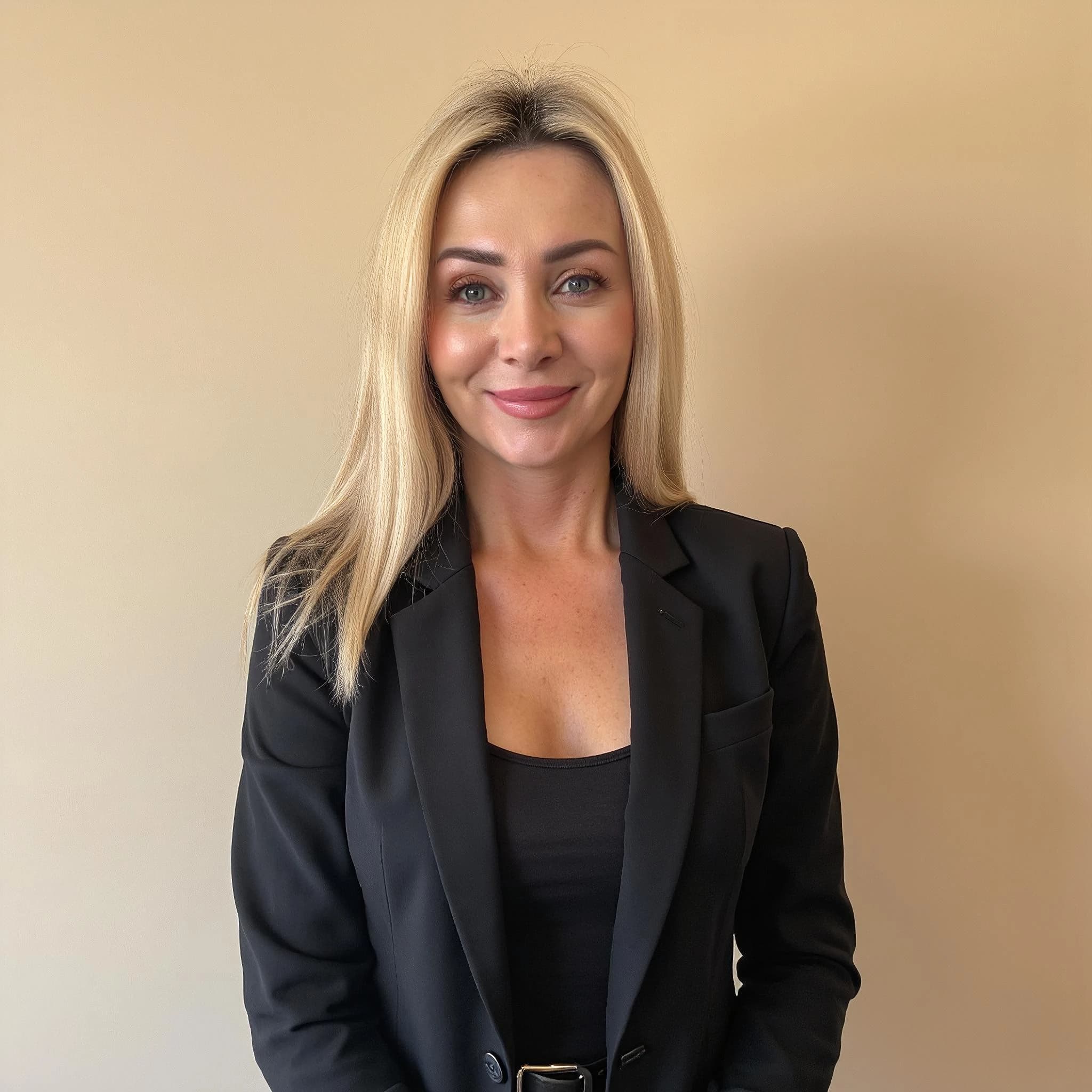 Professional headshot example: Woman Office Black Blazer Smiling 27 — LinkedInHeadshots.ai