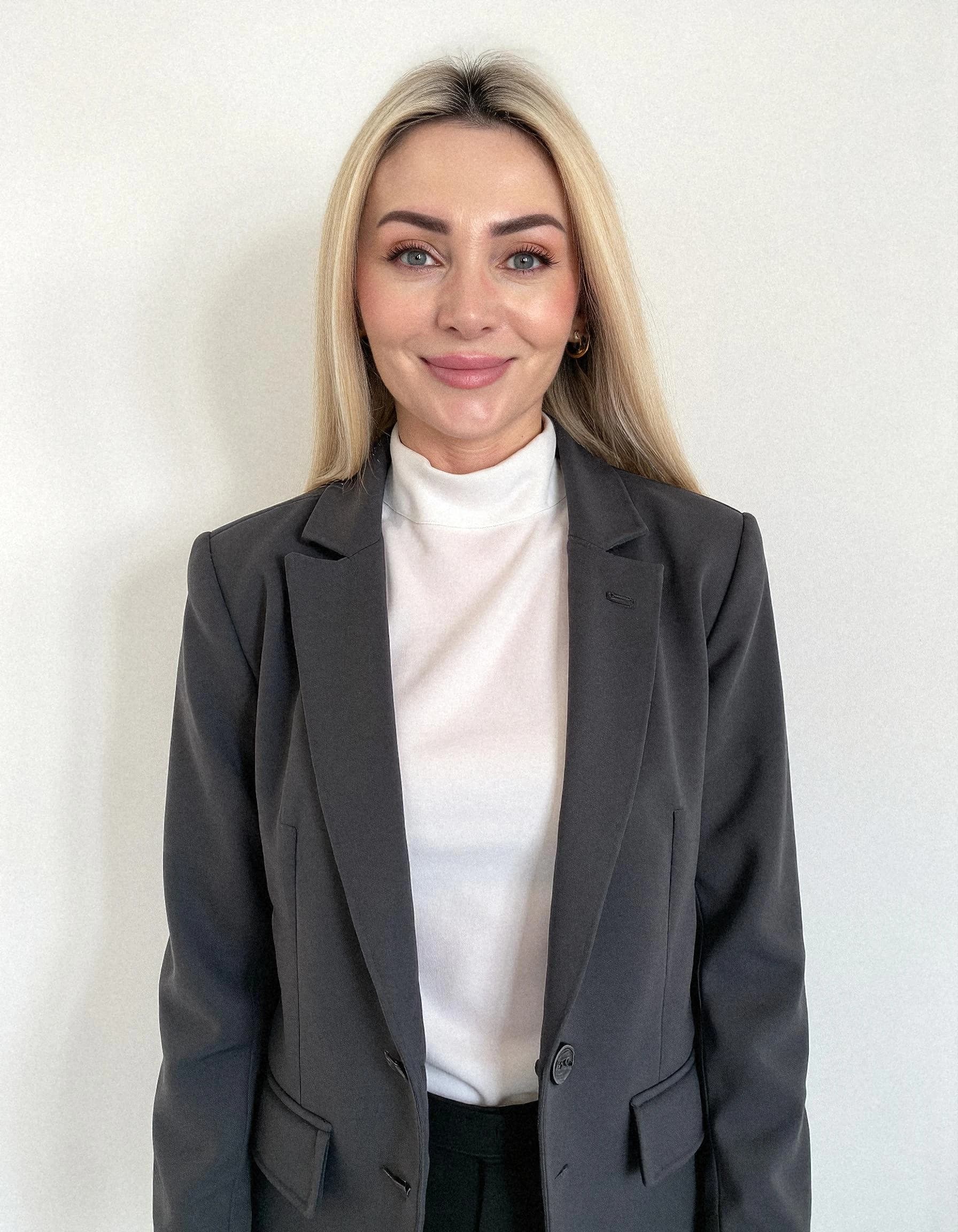 Professional headshot example: Woman Office Black Blazer Smiling 36 — LinkedInHeadshots.ai