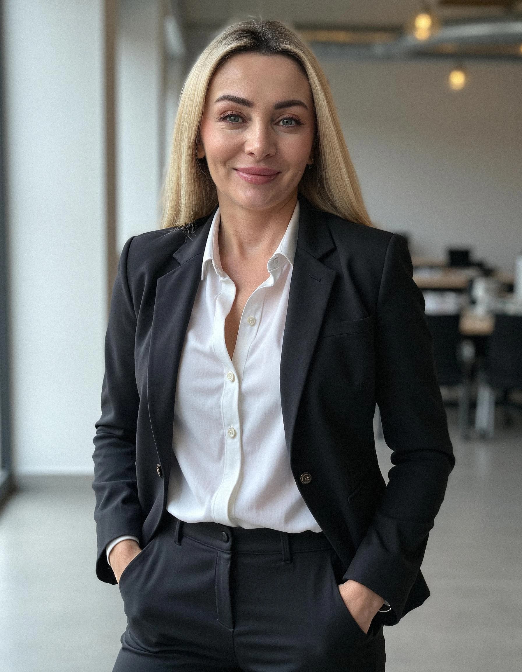 Professional headshot example: Woman Office Black Suit Smiling 16 — LinkedInHeadshots.ai