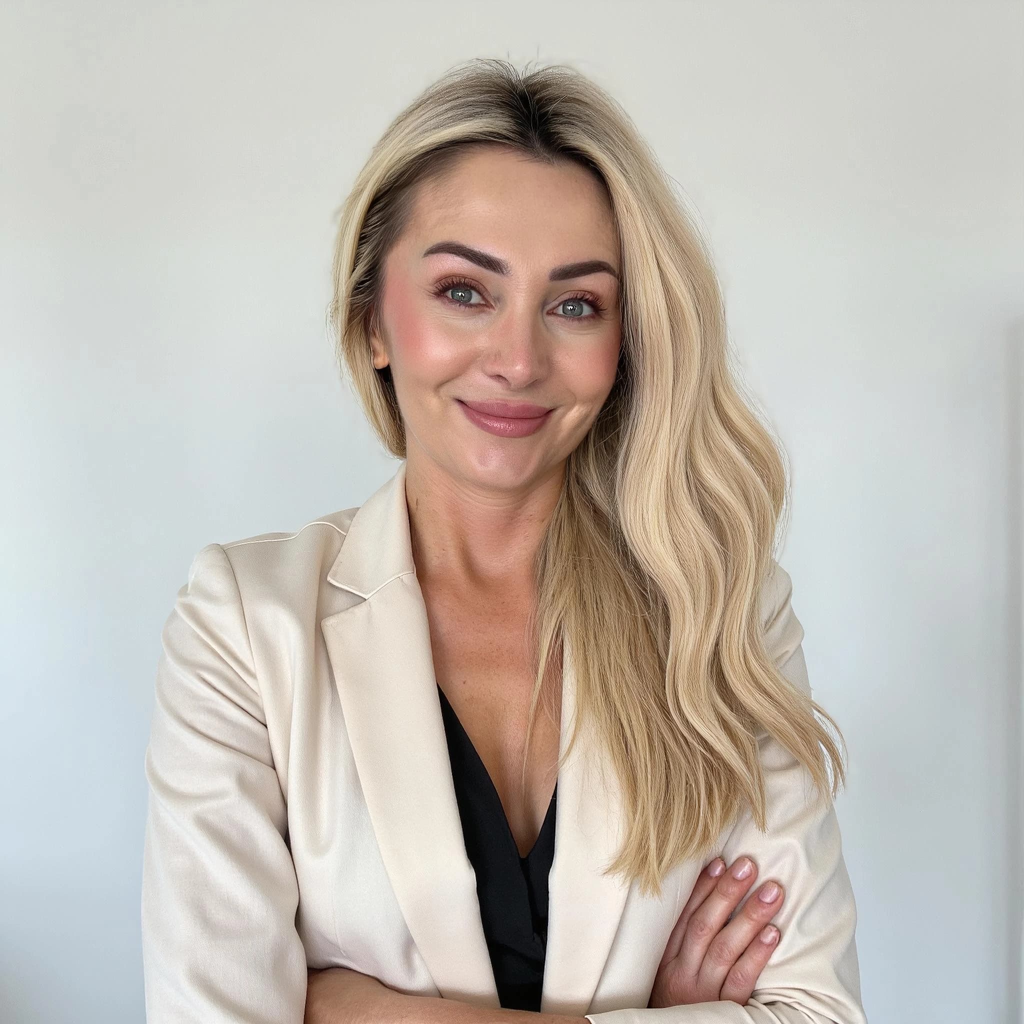 Professional headshot example: Woman Office Blazer Crossed Arms — LinkedInHeadshots.ai