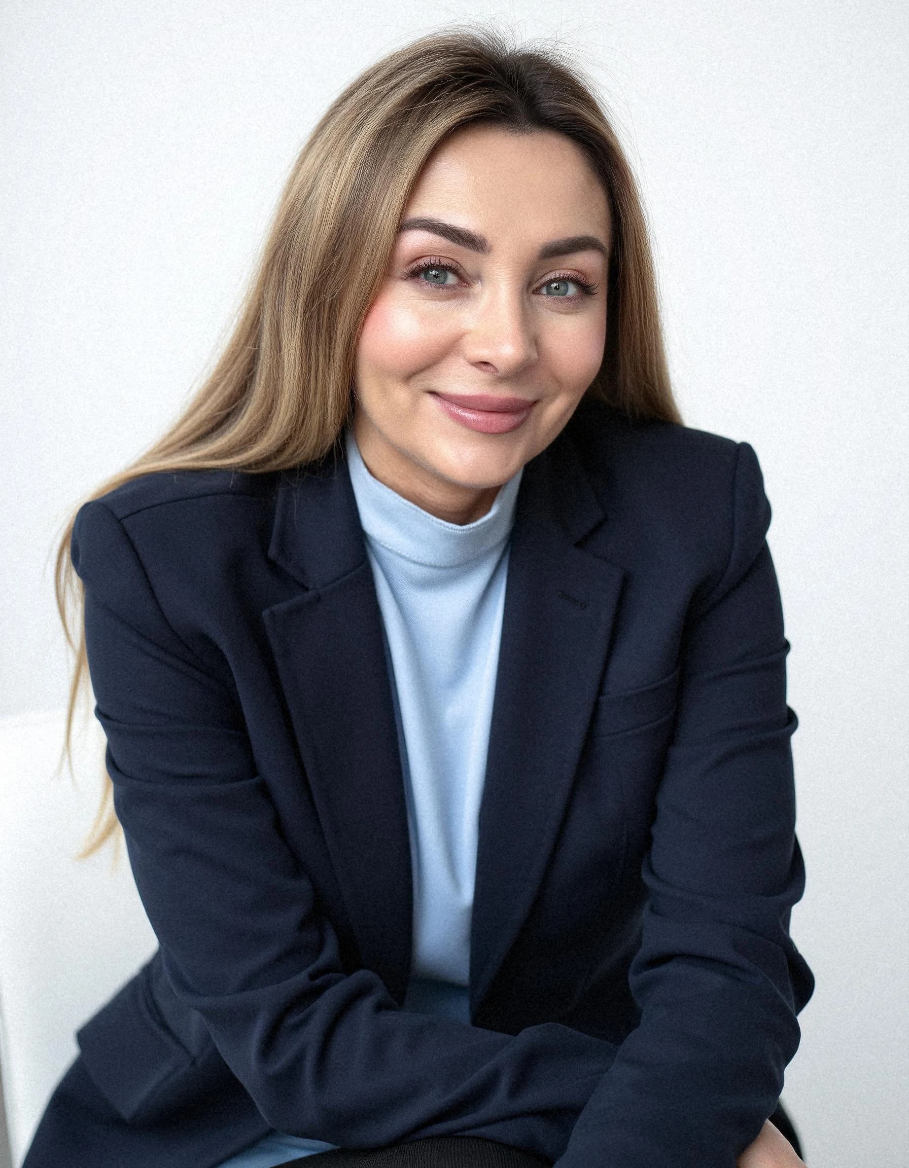 Professional headshot example: Woman Office Blue Blazer Smiling 2 — LinkedInHeadshots.ai