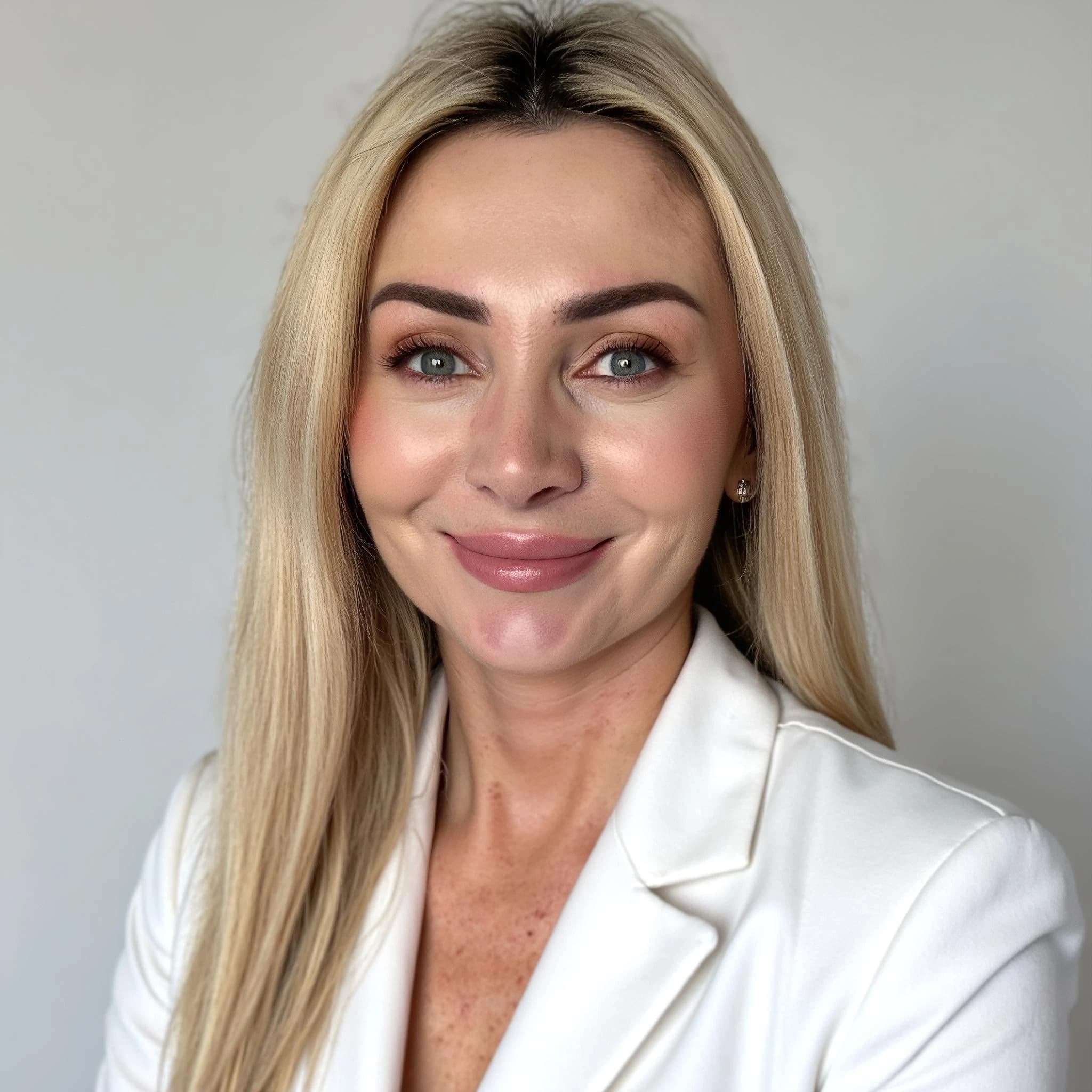 Professional headshot example: Woman Office White Blazer Smiling 2 — LinkedInHeadshots.ai