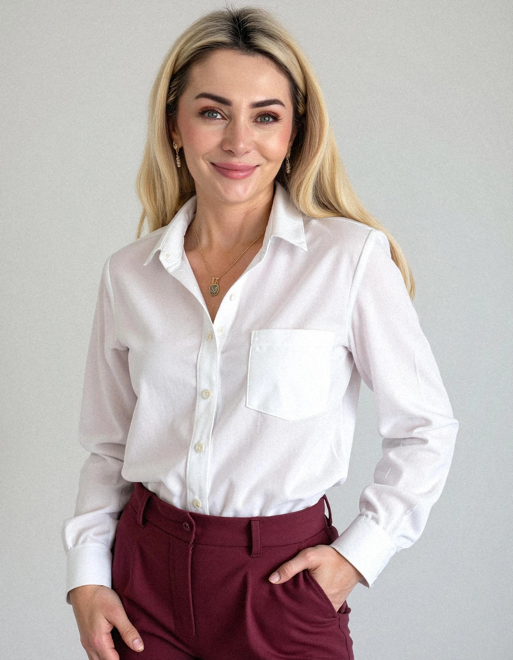 Professional headshot example: Woman Office White Shirt Smiling 11 — LinkedInHeadshots.ai