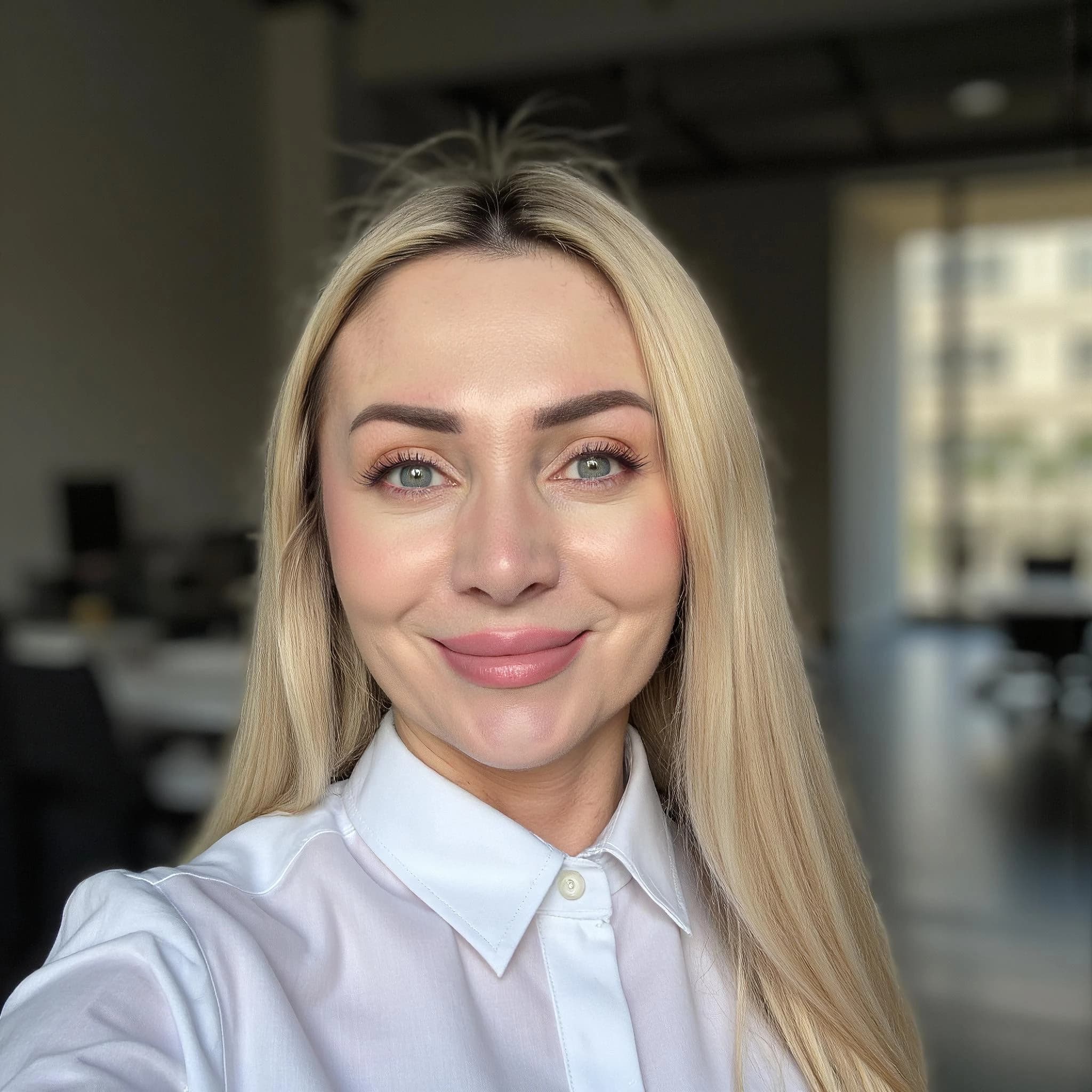 Professional headshot example: Woman Office White Shirt Smiling 4 — LinkedInHeadshots.ai
