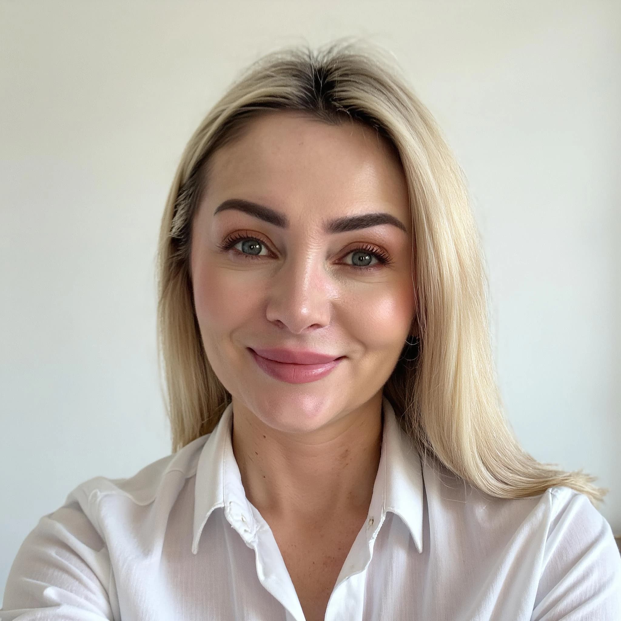 Professional headshot example: Woman Office White Shirt Smiling 6 — LinkedInHeadshots.ai