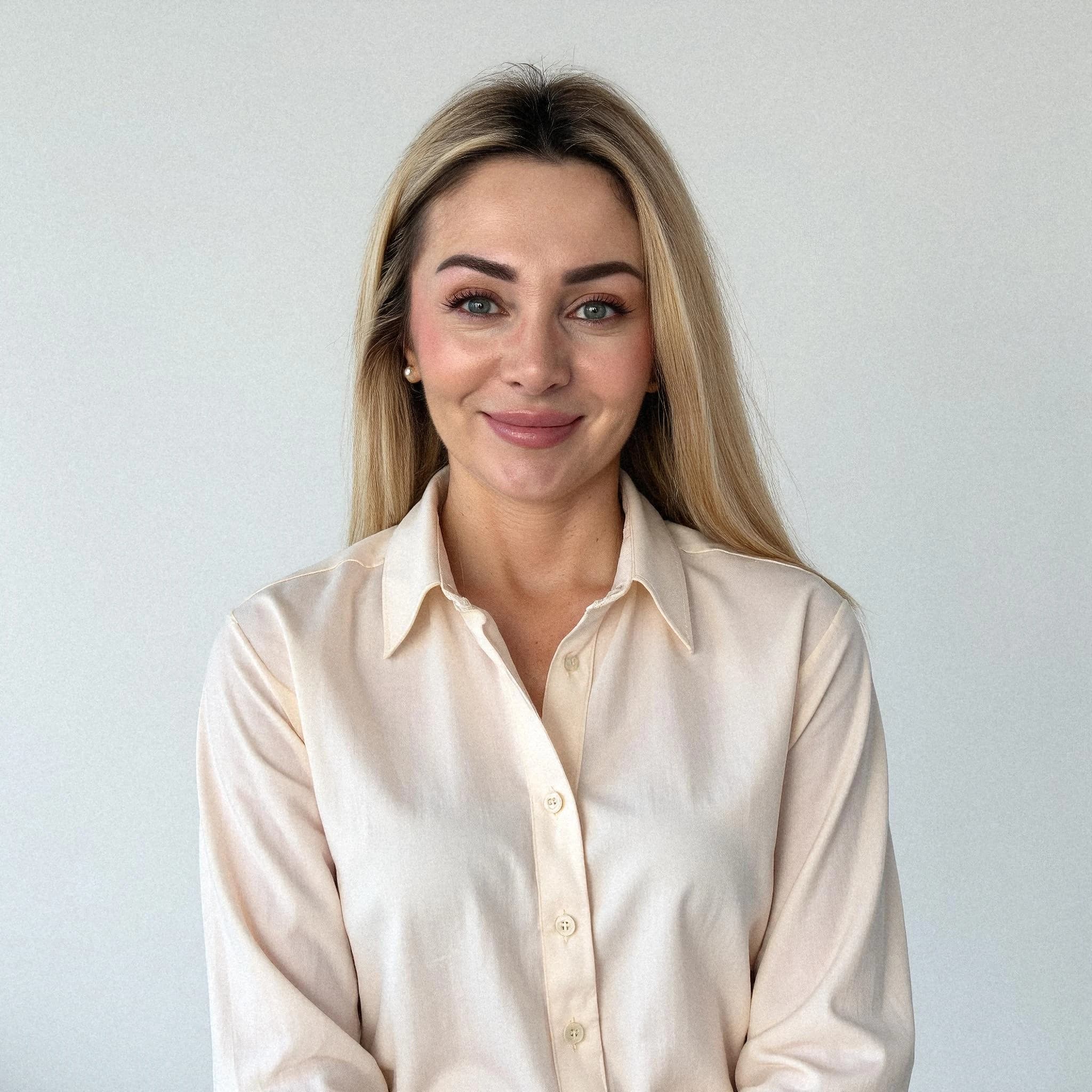 Professional headshot example: Woman Office White Shirt Smiling 7 — LinkedInHeadshots.ai