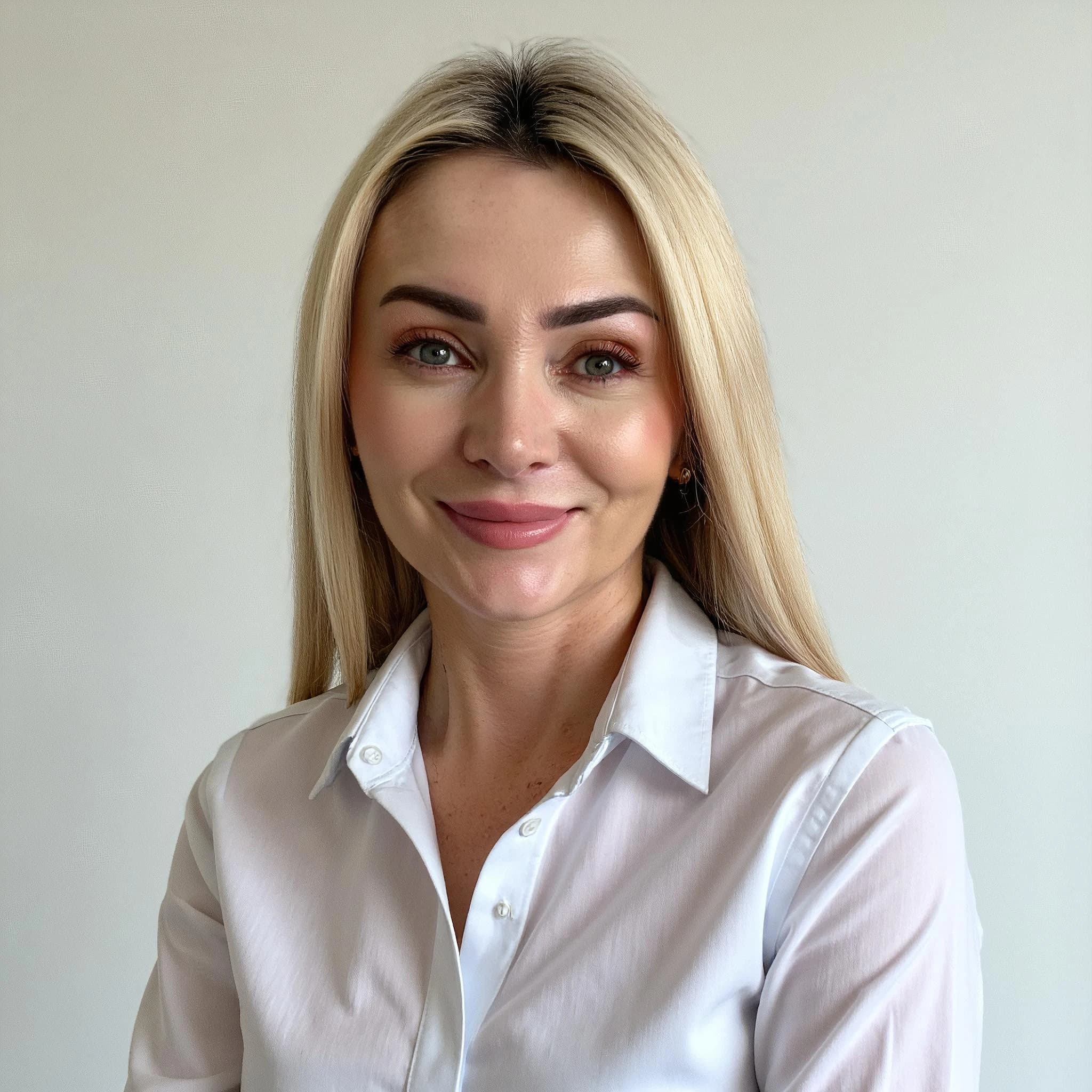 Professional headshot example: Woman Office White Shirt Smiling 8 — LinkedInHeadshots.ai