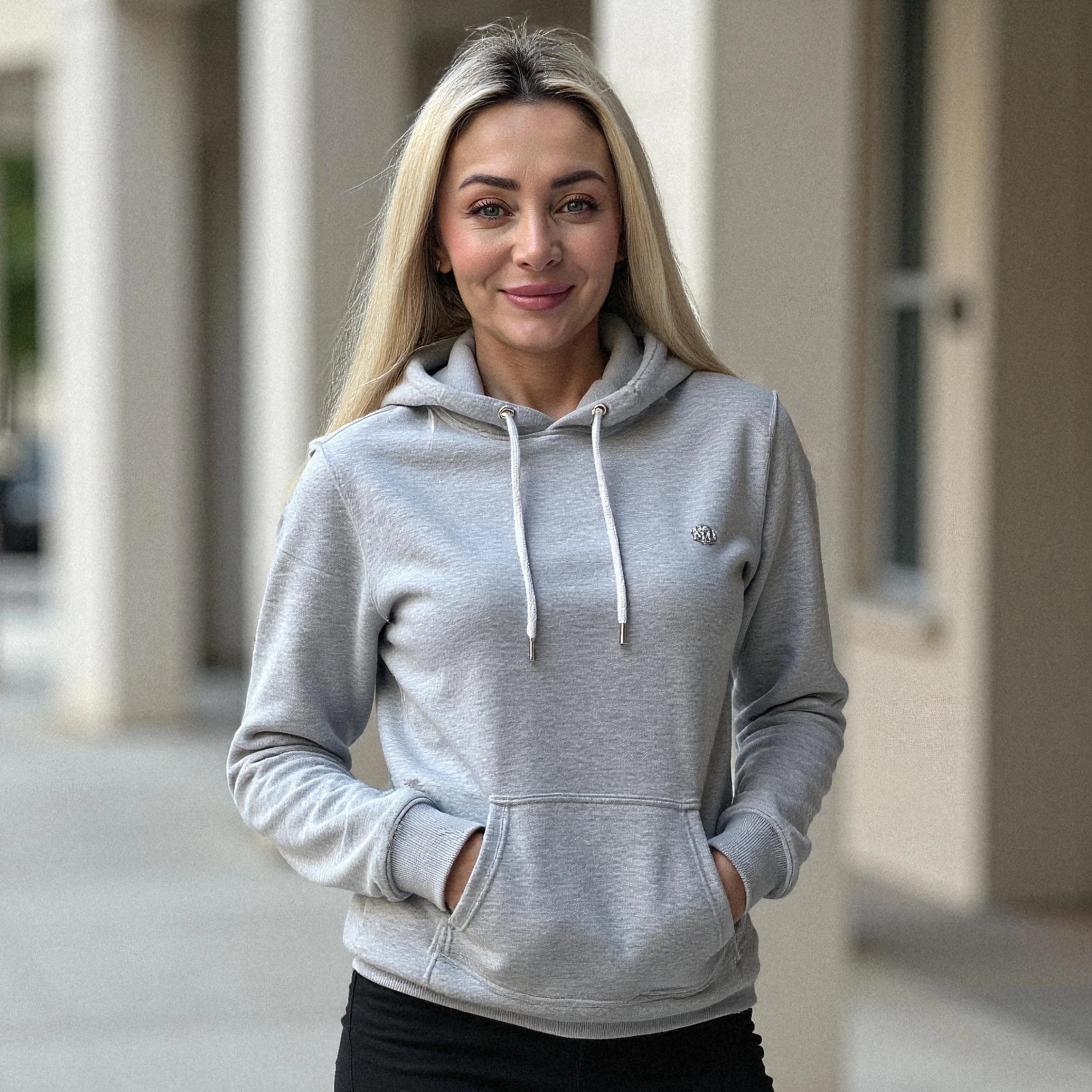 Professional headshot example: Woman Outdoors Gray Hoodie Smiling — LinkedInHeadshots.ai