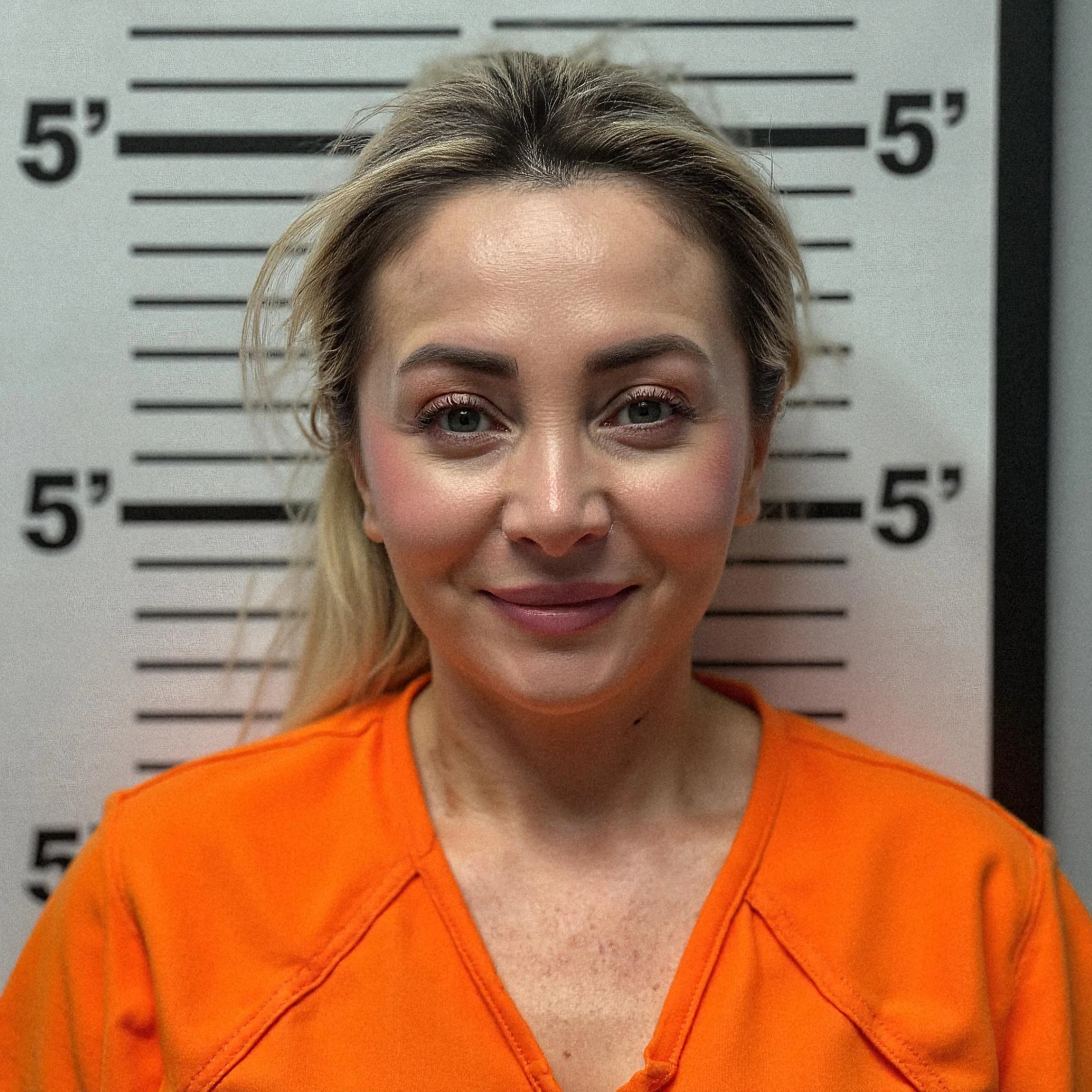 Professional headshot example: Woman Police Station Orange Uniform Smiling — LinkedInHeadshots.ai