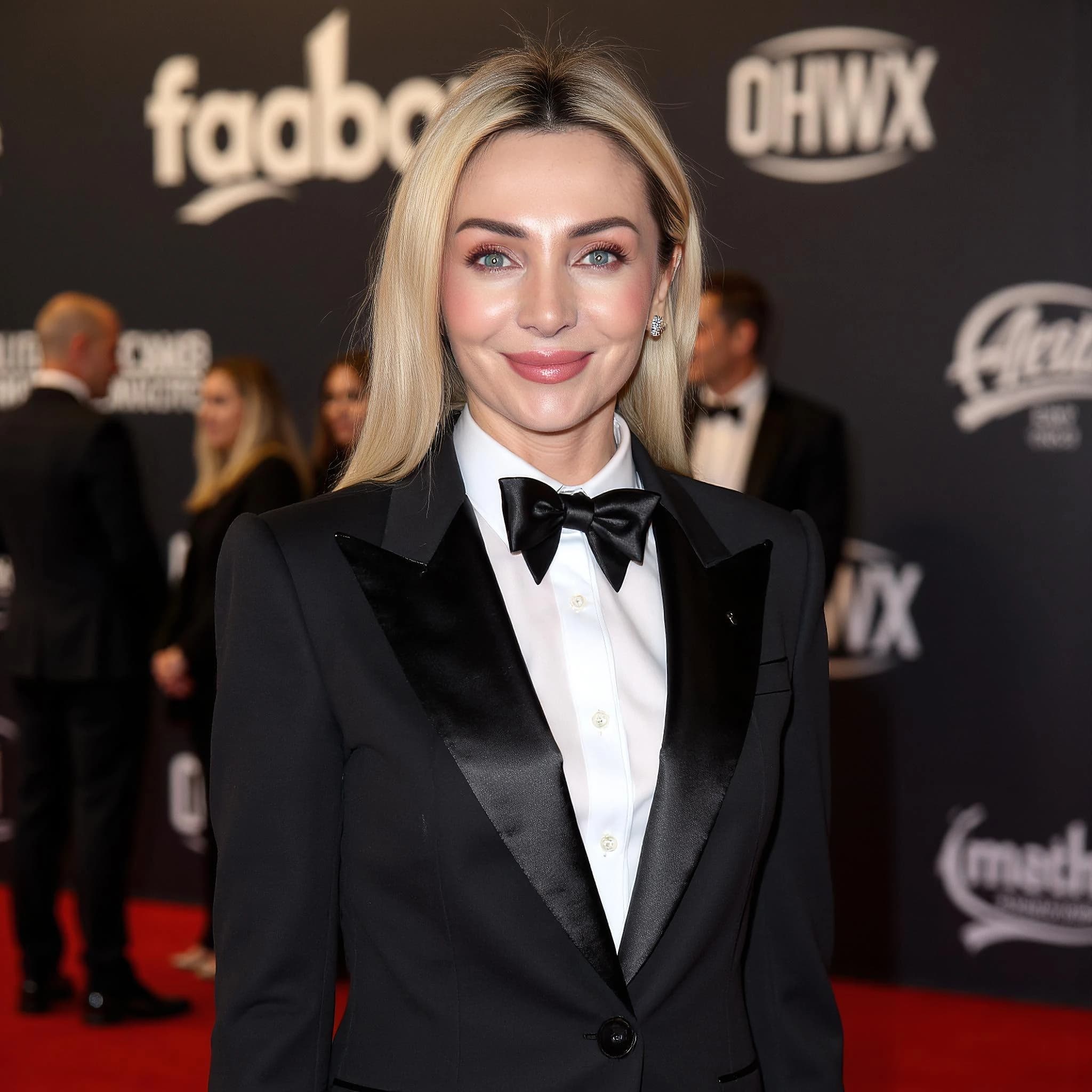 Professional headshot example: Woman Red Carpet Black Tuxedo Smiling 2 — LinkedInHeadshots.ai