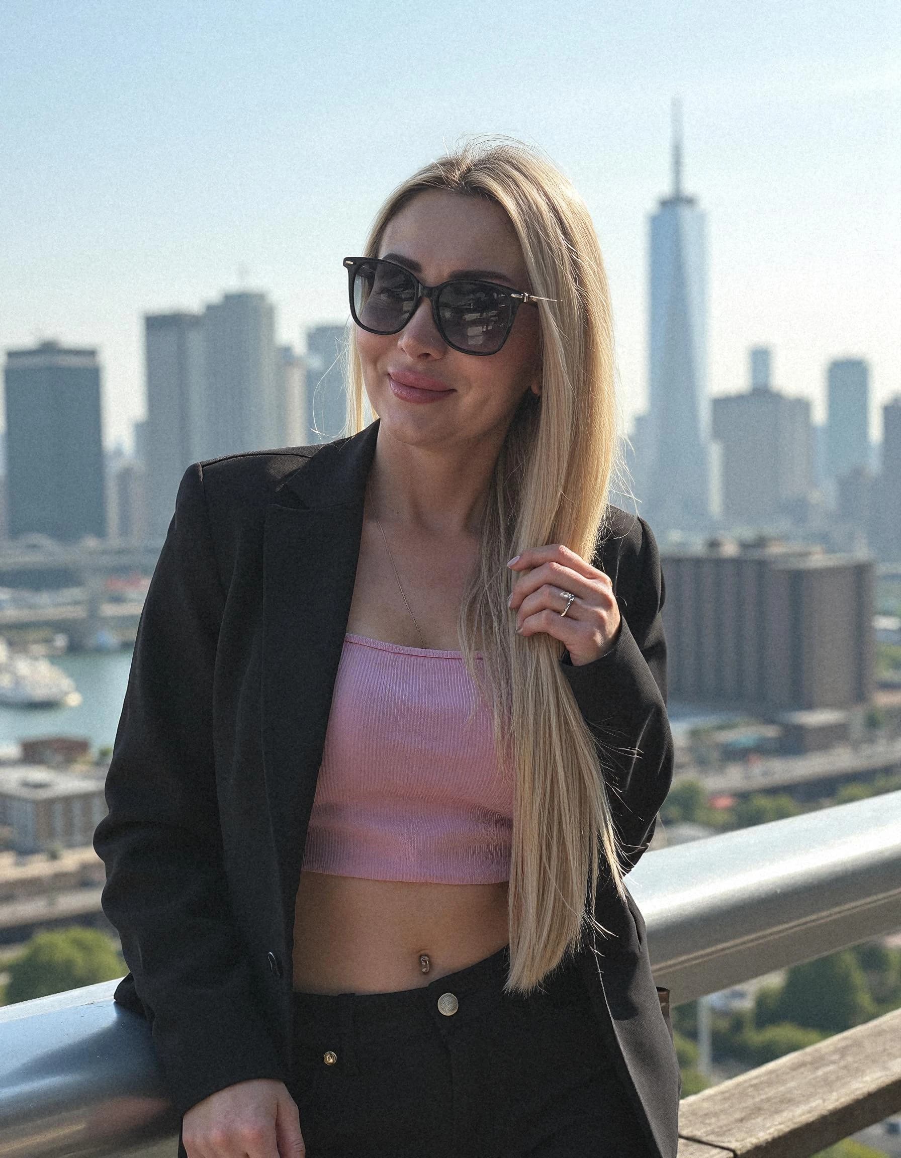 Professional headshot example: Woman Rooftop Black Jacket Sunglasses — LinkedInHeadshots.ai