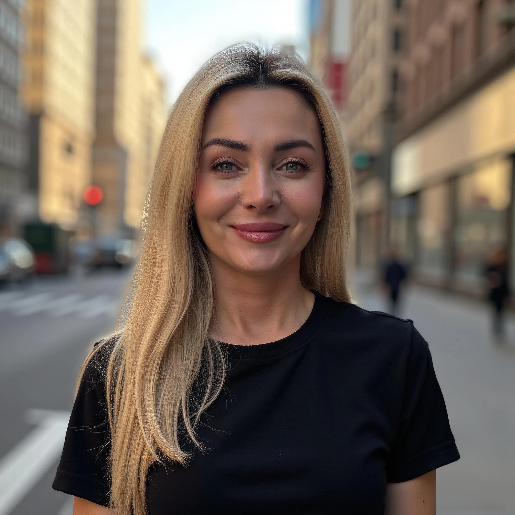 Professional headshot example: Woman Street Black Shirt Smiling 2 — LinkedInHeadshots.ai