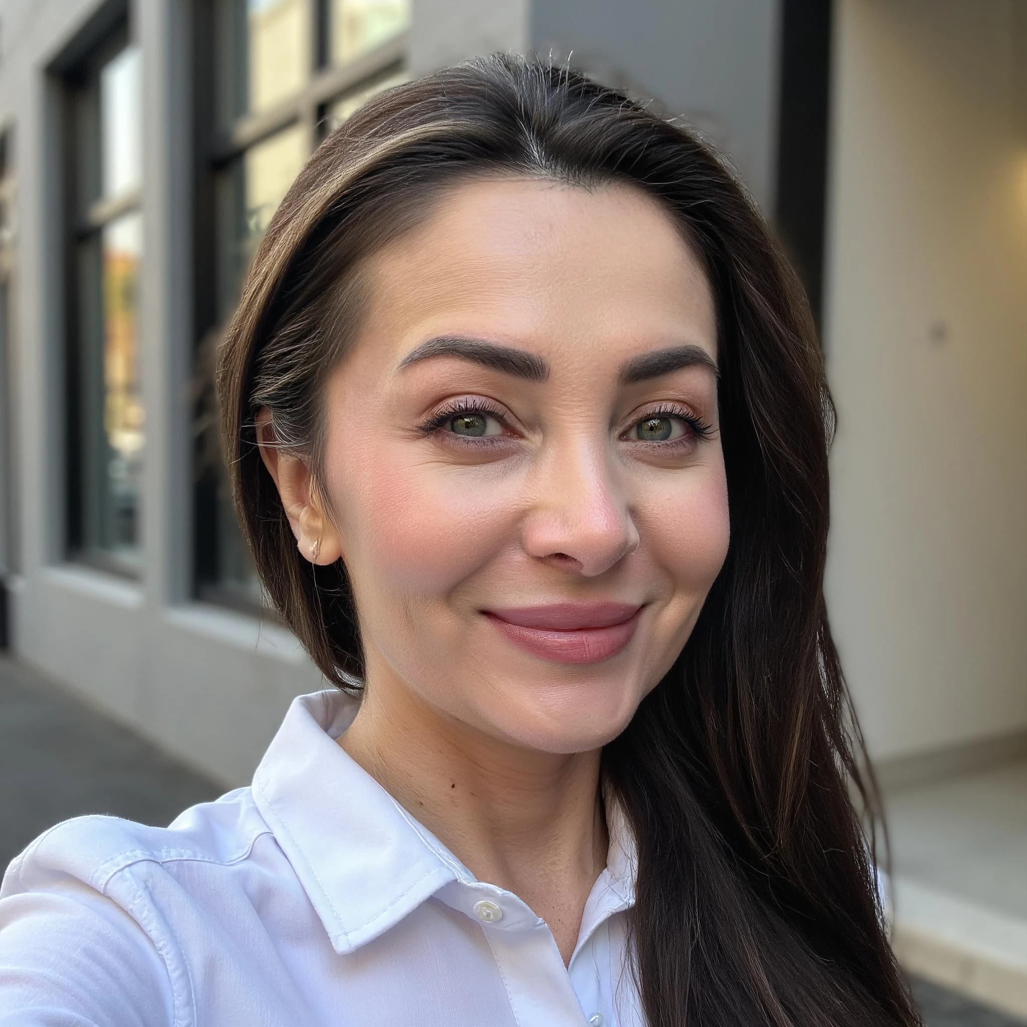 Professional headshot example: Woman Street White Shirt Smiling — LinkedInHeadshots.ai