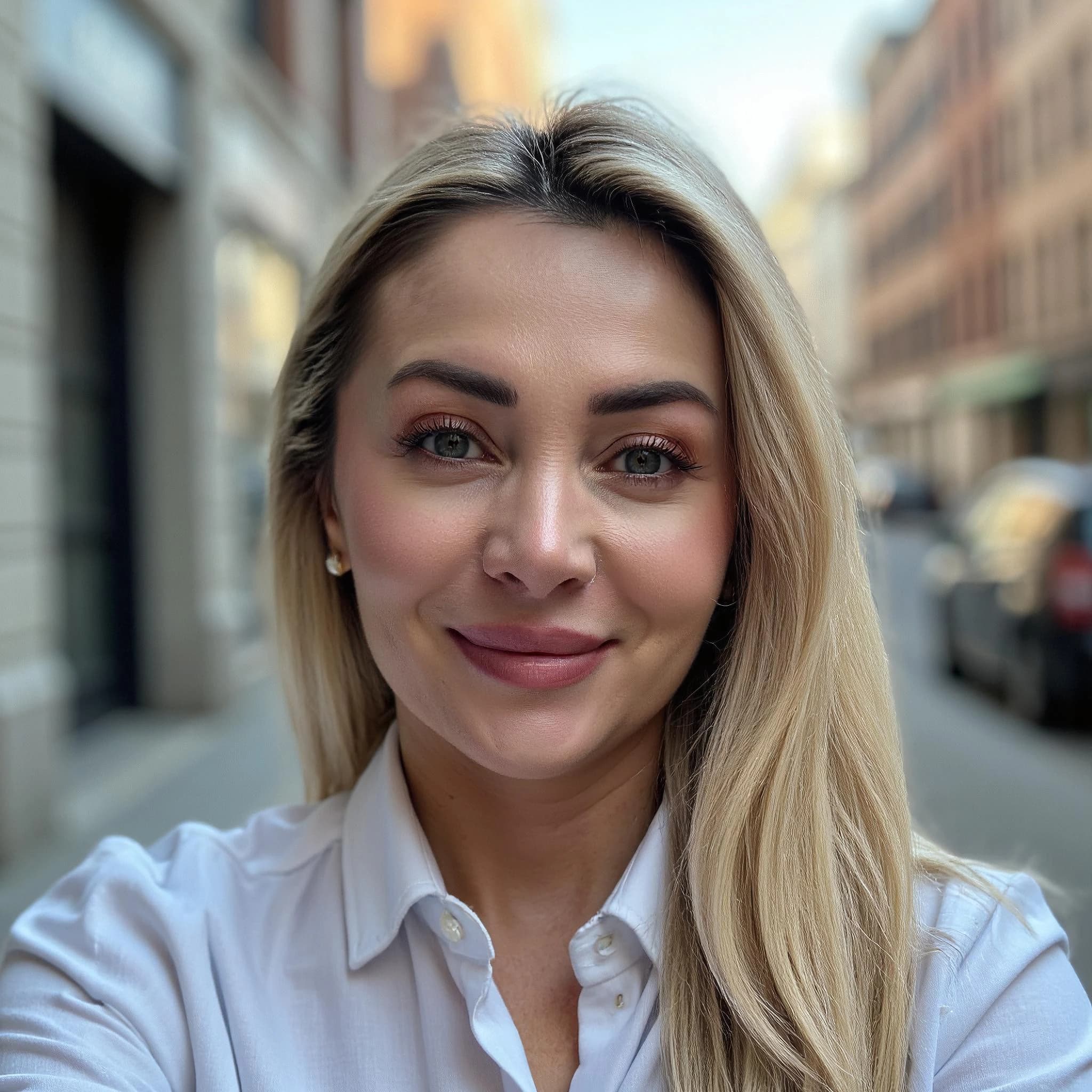 Professional headshot example: Woman Street White Shirt Smiling 3 — LinkedInHeadshots.ai