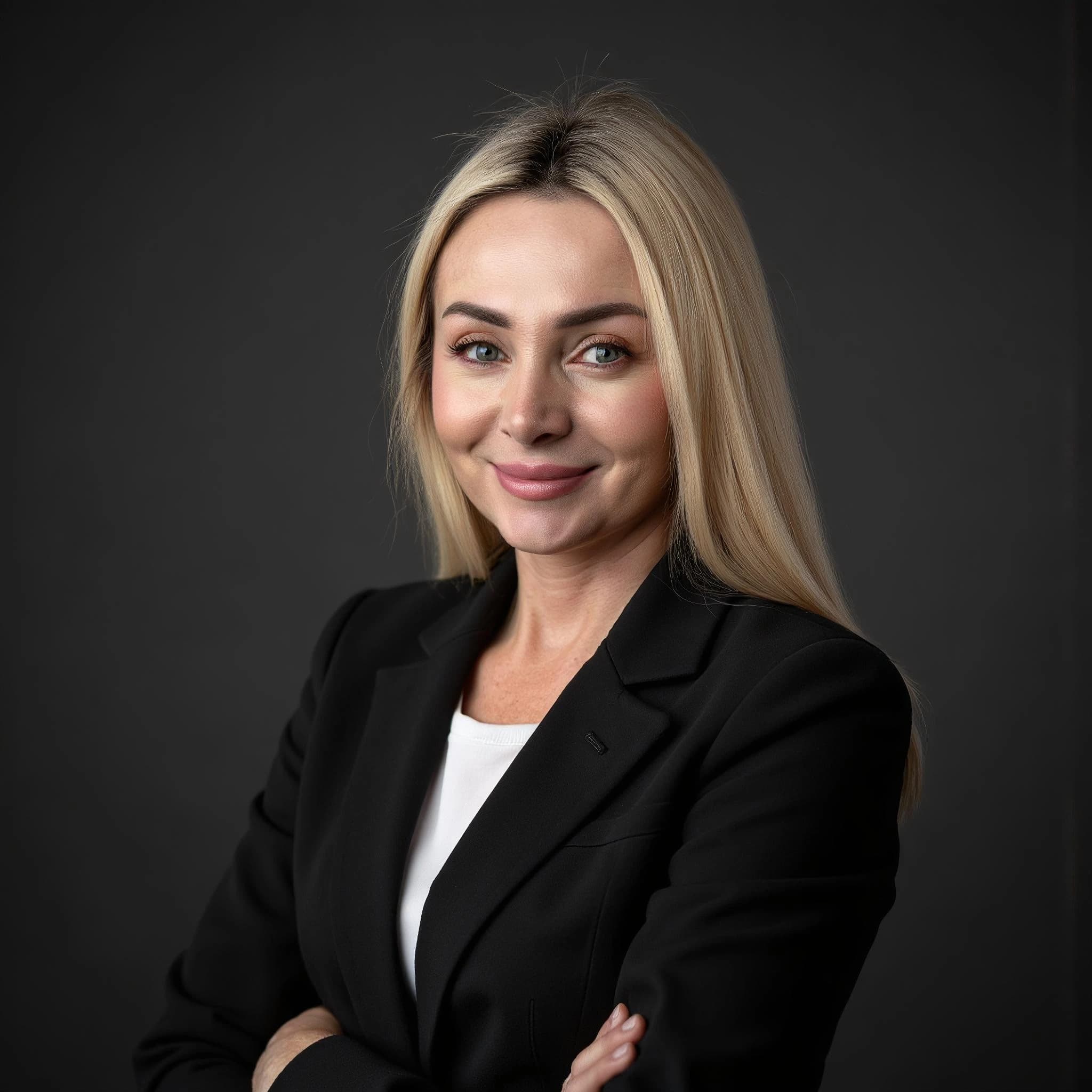 Professional headshot example: Woman Studio Black Blazer Smiling 10 — LinkedInHeadshots.ai
