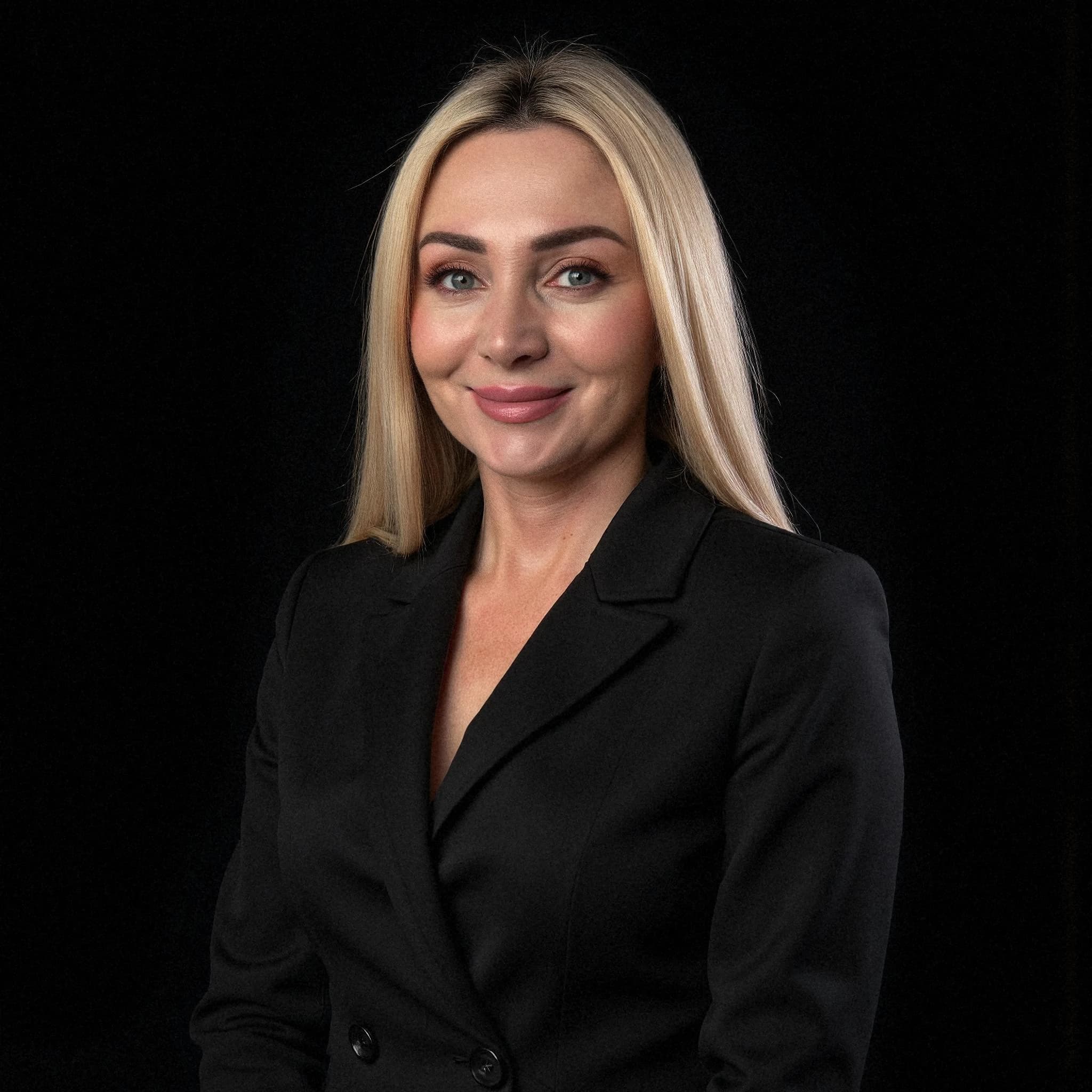 Professional headshot example: Woman Studio Black Blazer Smiling 12 — LinkedInHeadshots.ai