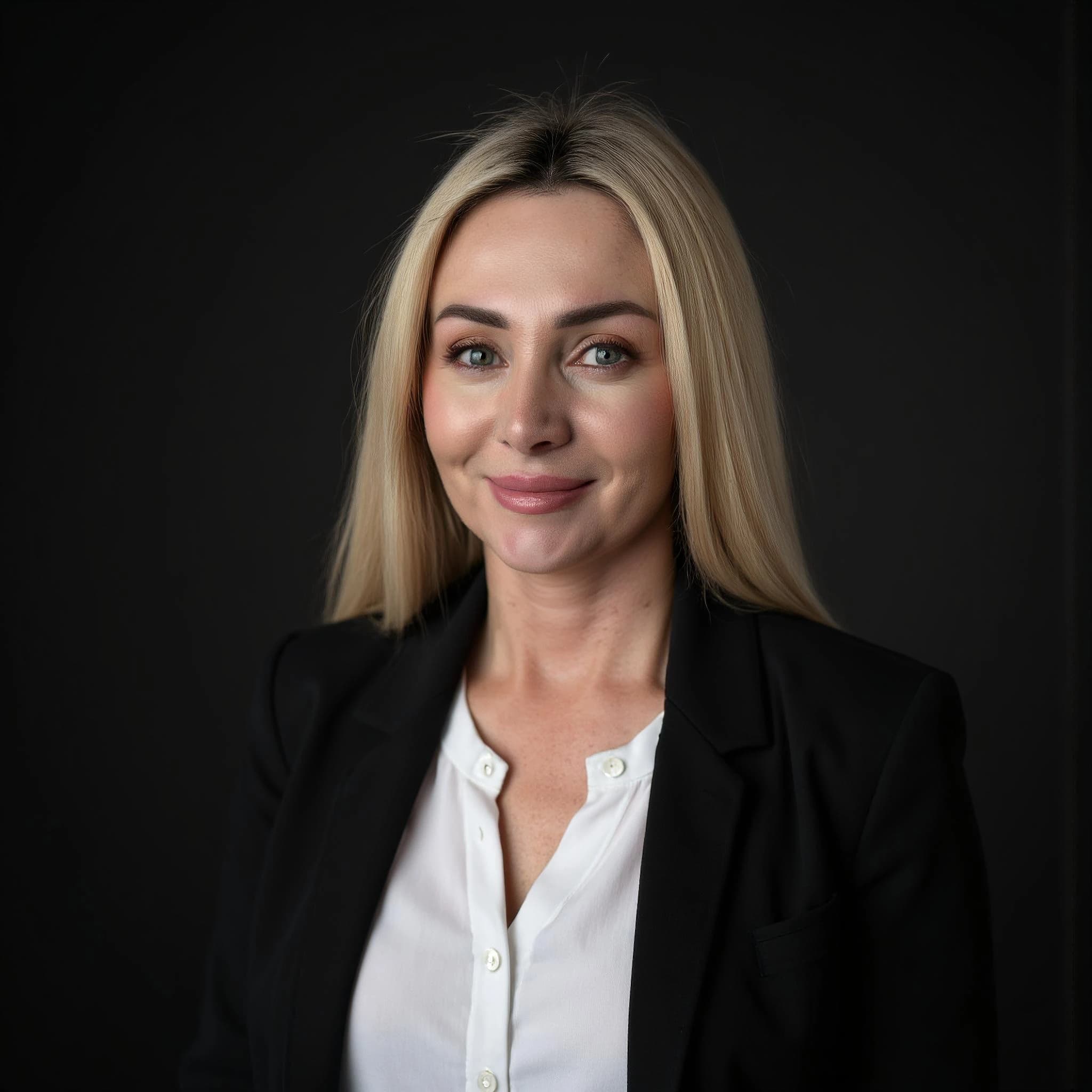 Professional headshot example: Woman Studio Black Blazer Smiling 3 — LinkedInHeadshots.ai