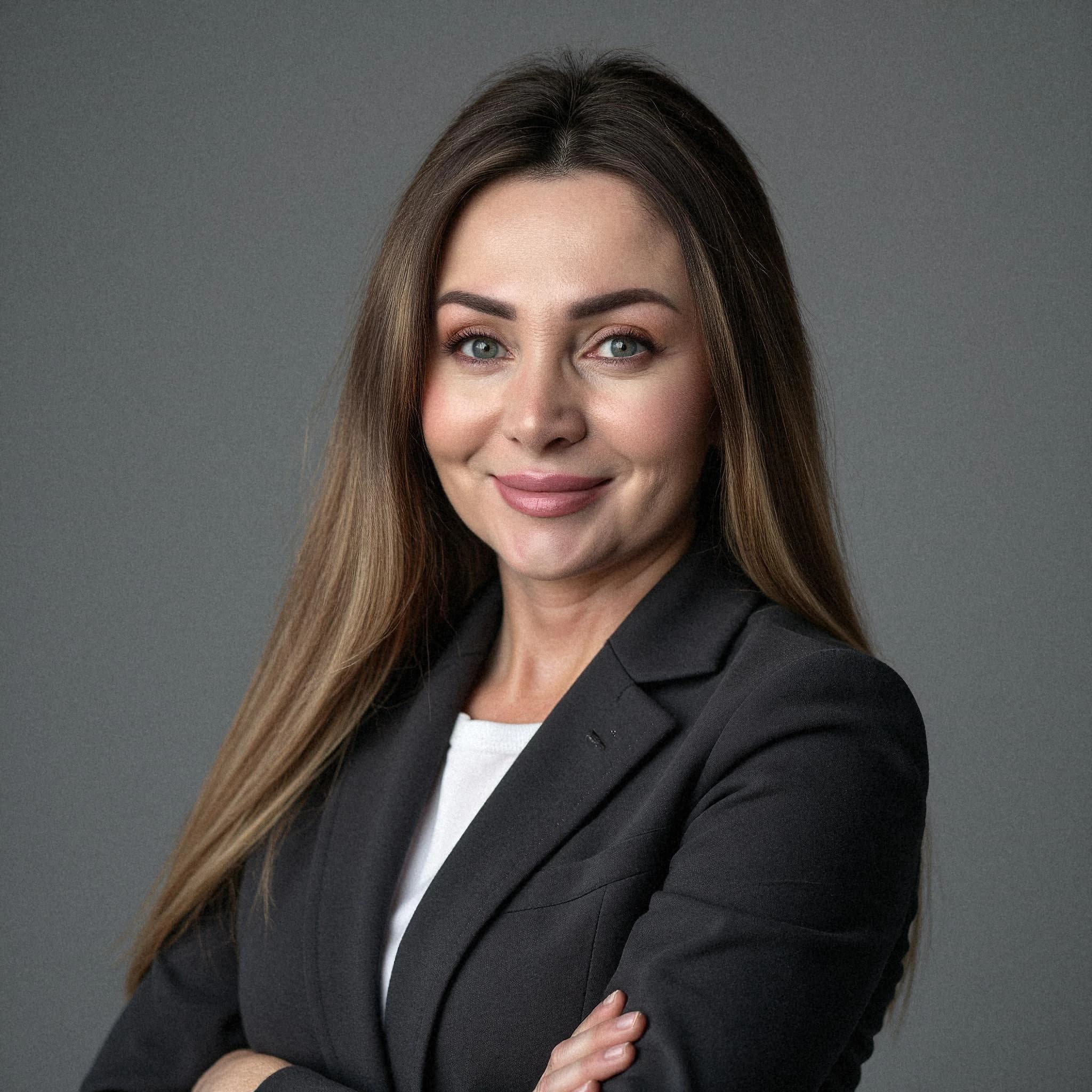 Professional headshot example: Woman Studio Black Blazer Smiling 30 — LinkedInHeadshots.ai