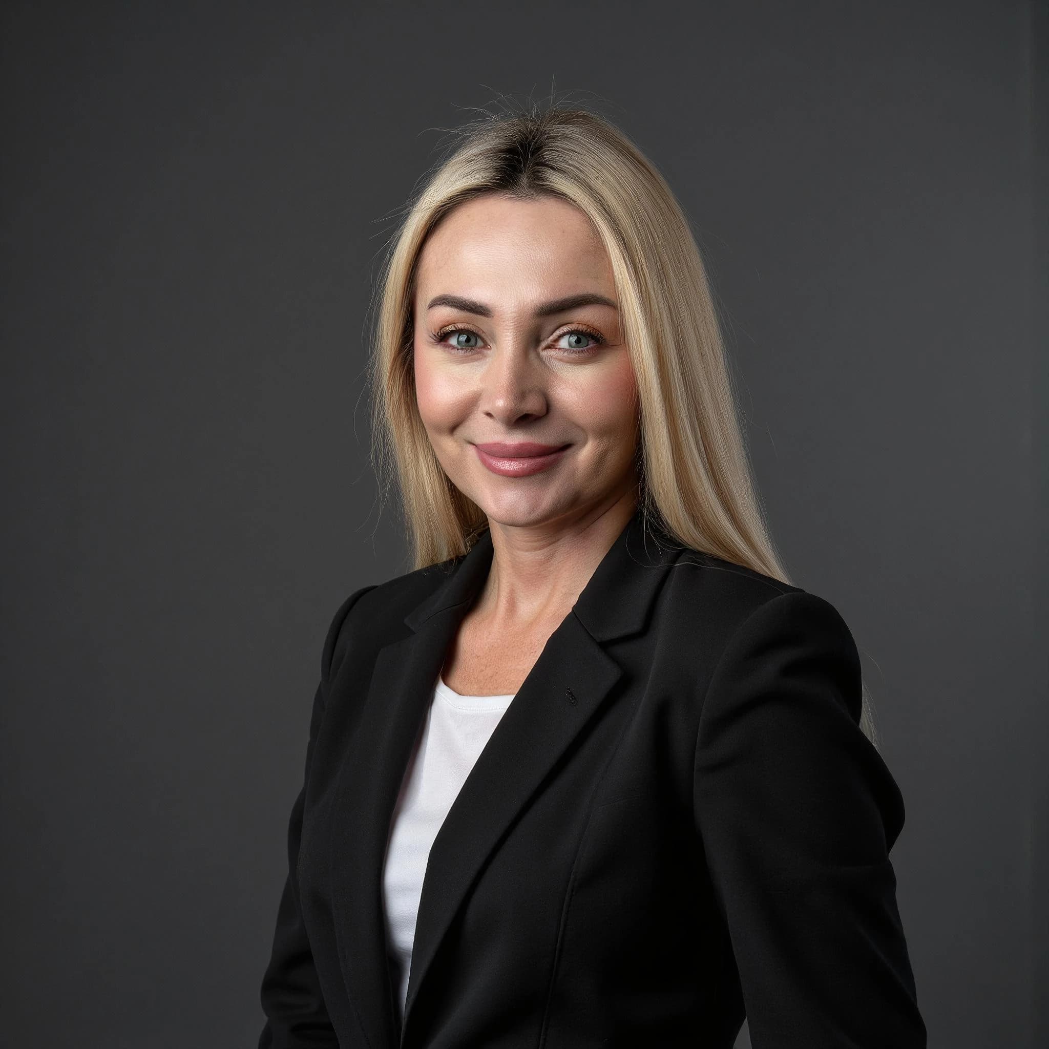 Professional headshot example: Woman Studio Black Blazer Smiling 4 — LinkedInHeadshots.ai