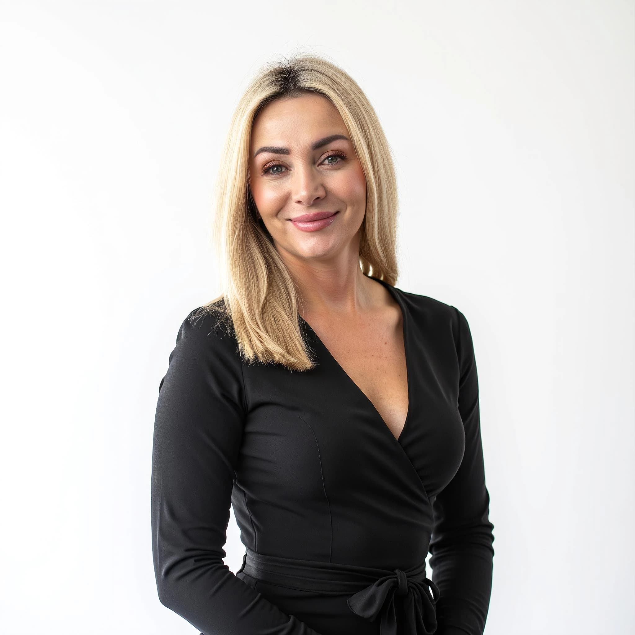 Professional headshot example: Woman Studio Black Dress Smiling — LinkedInHeadshots.ai