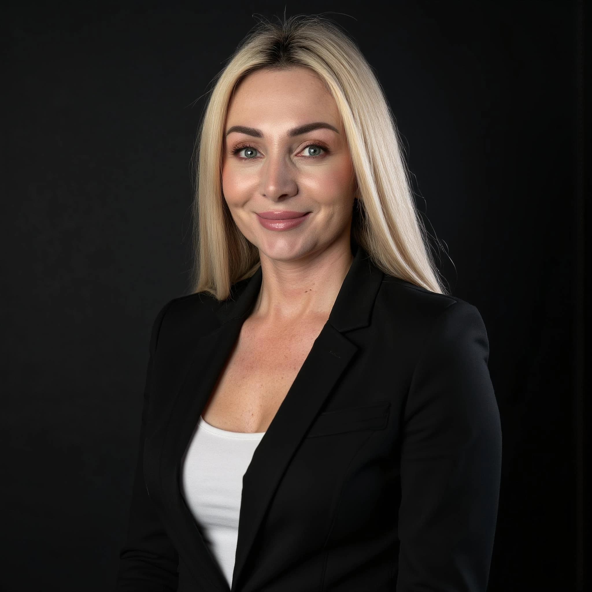 Professional headshot example: Woman Studio Black Jacket Smiling 3 — LinkedInHeadshots.ai