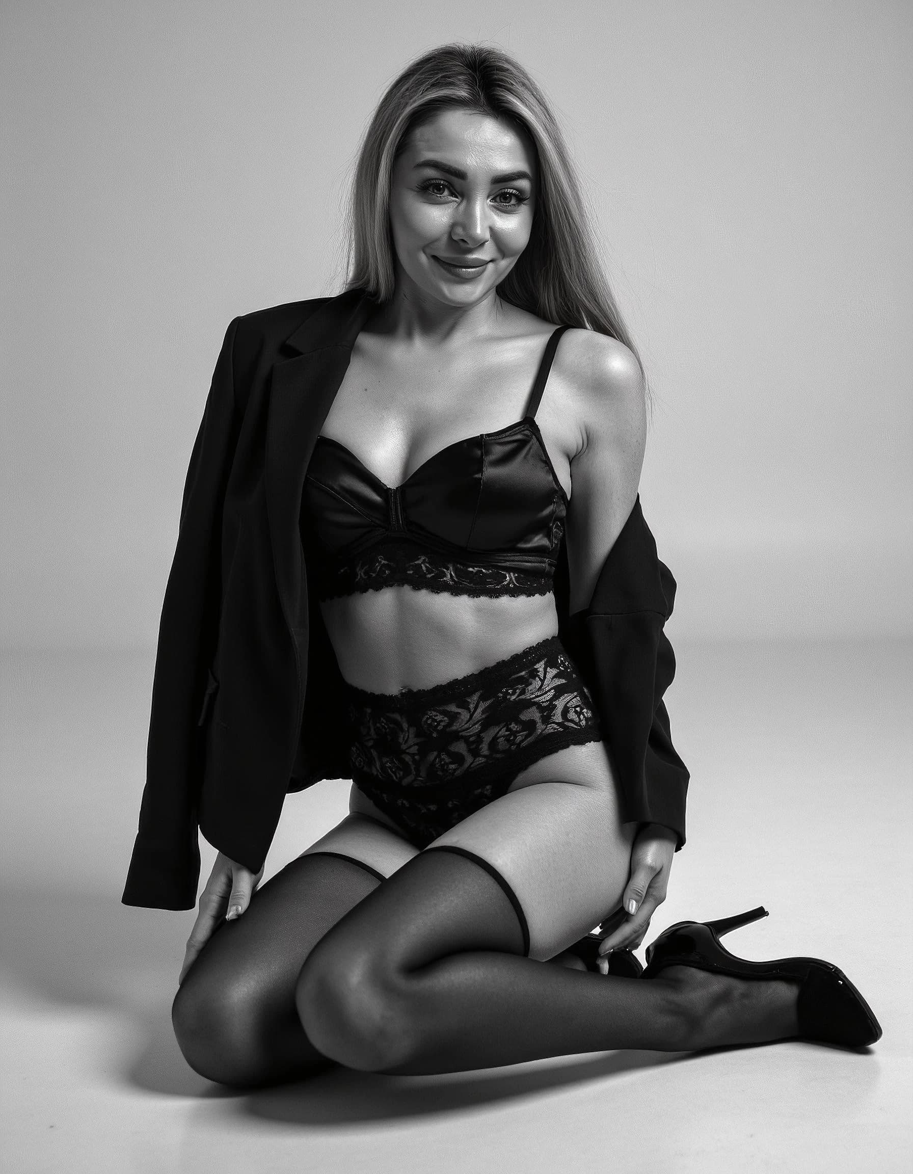Professional headshot example: Woman Studio Black Lingerie Kneeling — LinkedInHeadshots.ai