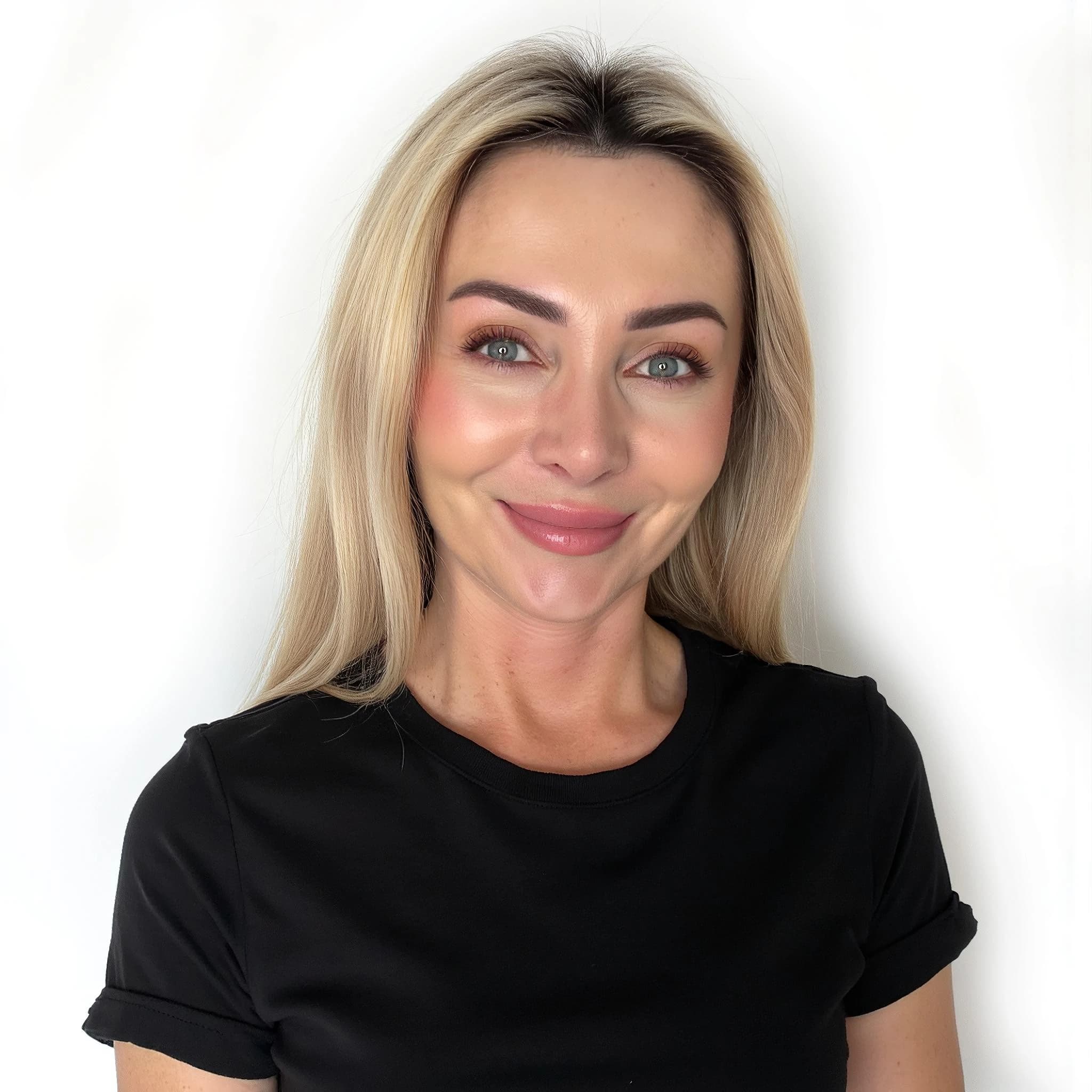 Professional headshot example: Woman Studio Black Shirt Smiling 5 — LinkedInHeadshots.ai