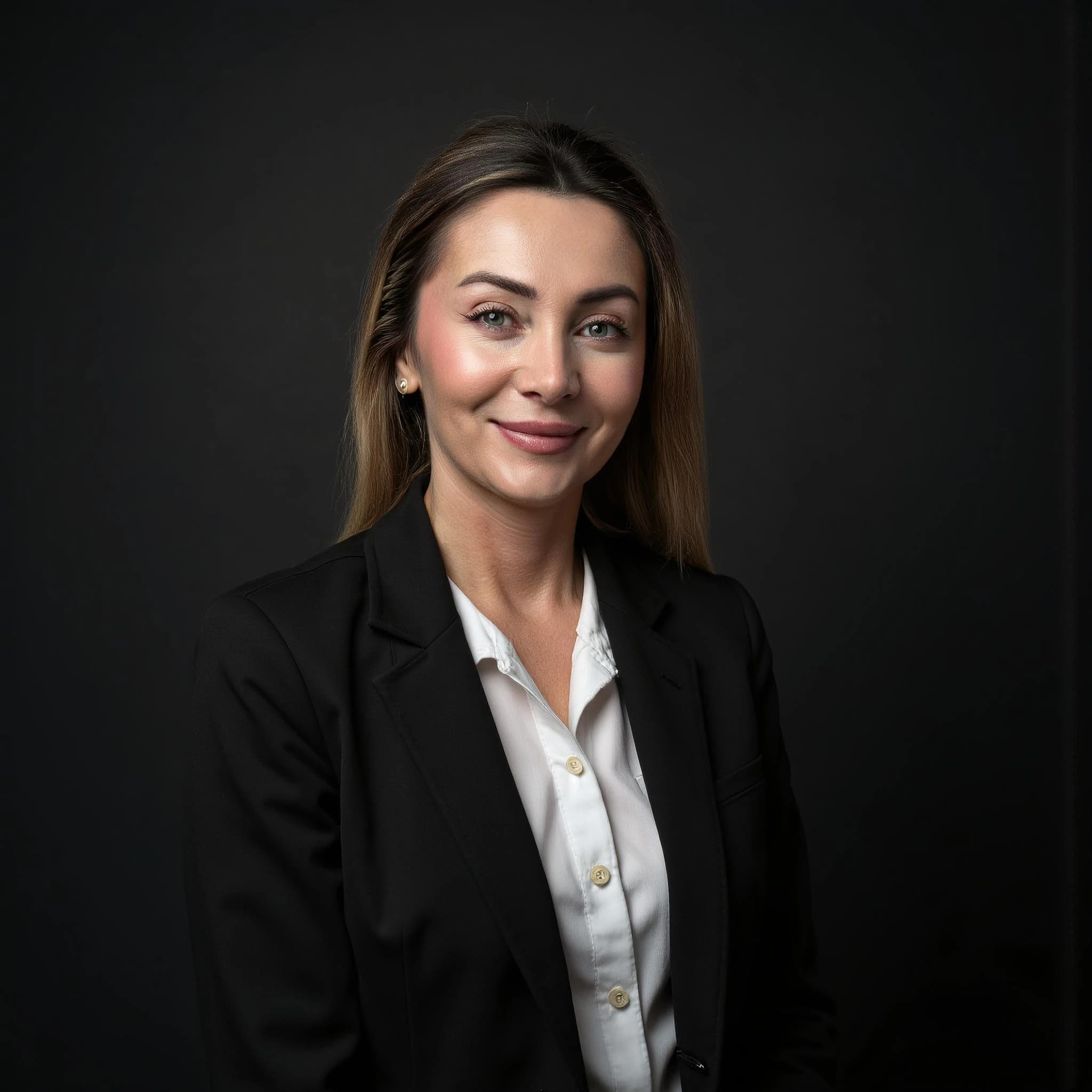 Professional headshot example: Woman Studio Black Suit Smiling 16 — LinkedInHeadshots.ai