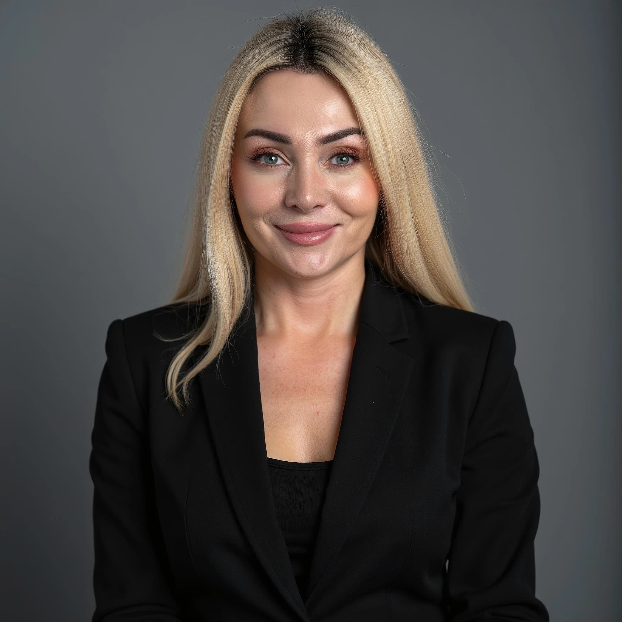 Professional headshot example: Woman Studio Black Suit Smiling 24 — LinkedInHeadshots.ai