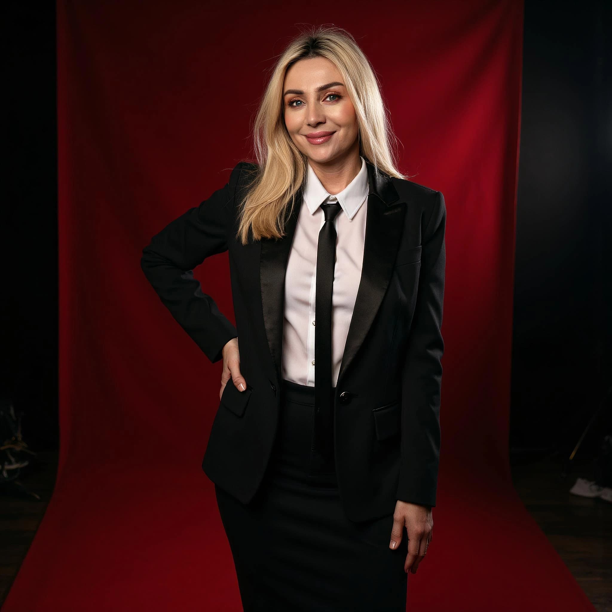 Professional headshot example: Woman Studio Black Suit Smiling 35 — LinkedInHeadshots.ai