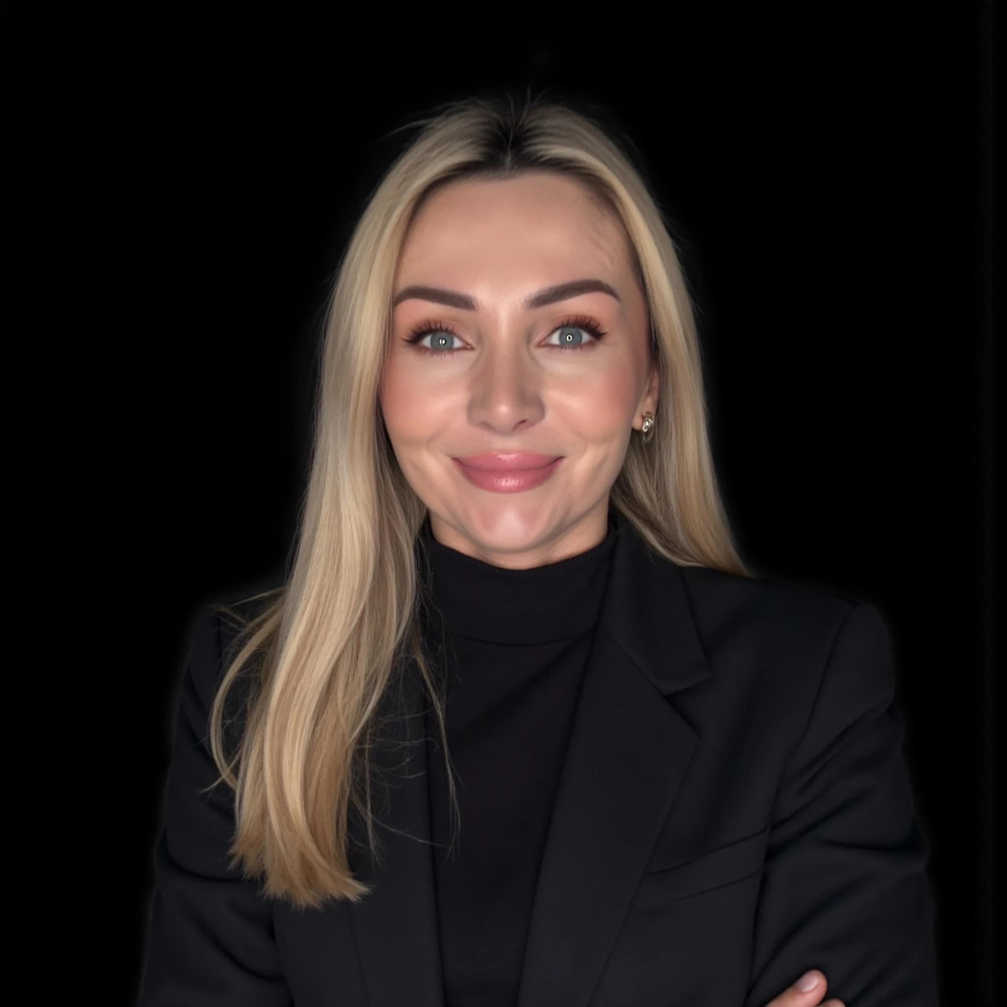 Professional headshot example: Woman Studio Black Suit Smiling 36 — LinkedInHeadshots.ai