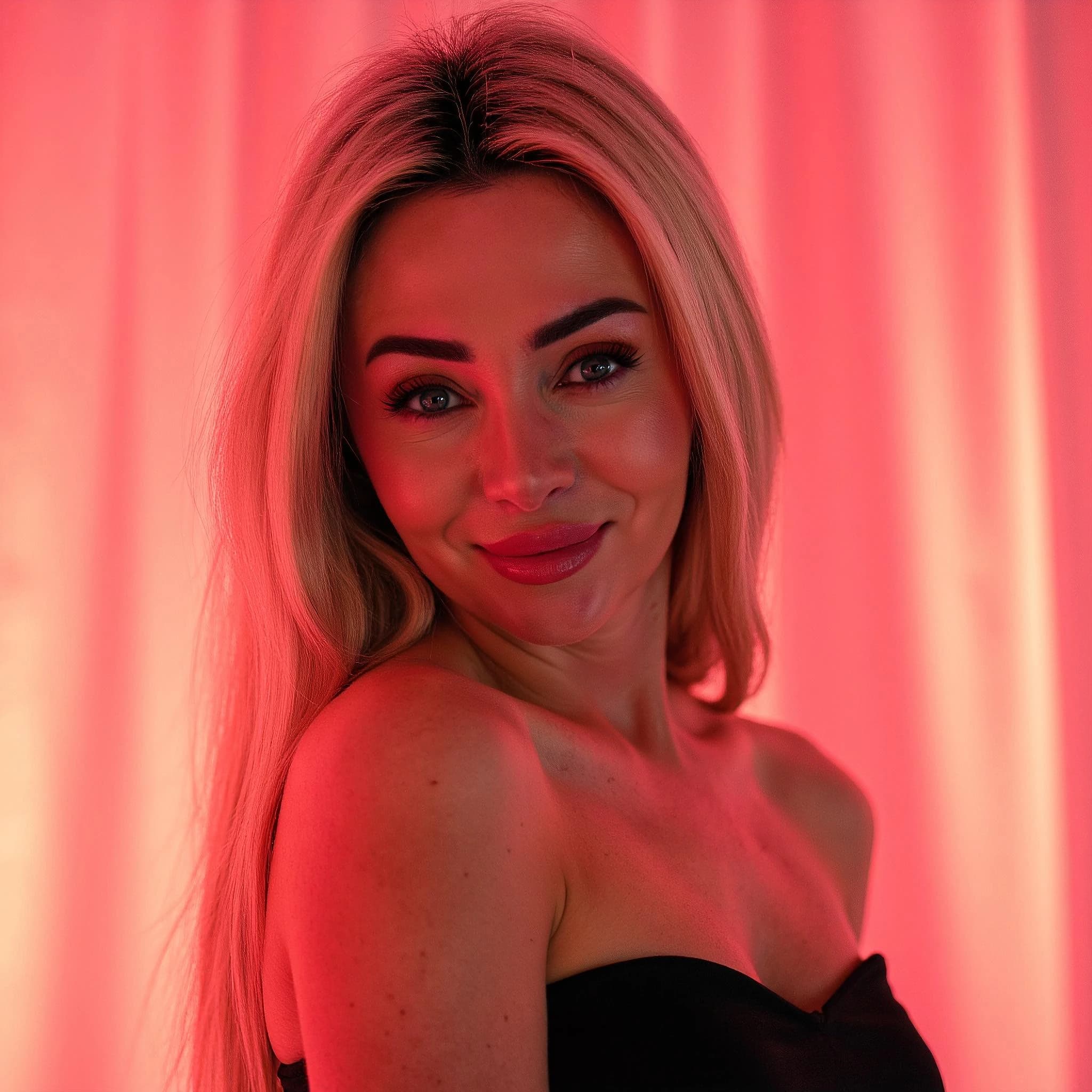 Professional headshot example: Woman Studio Black Top Smiling 10 — LinkedInHeadshots.ai