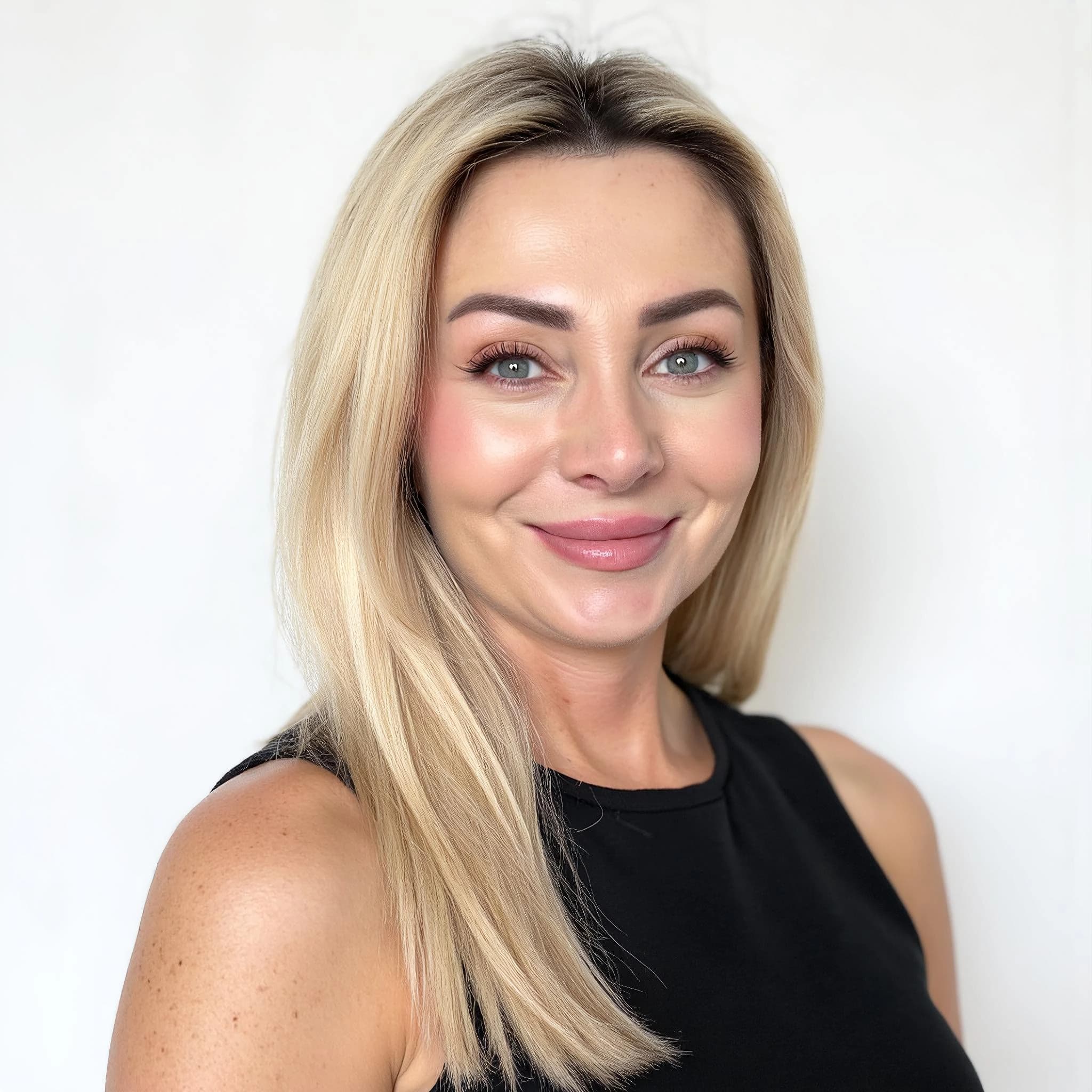 Professional headshot example: Woman Studio Black Top Smiling 6 — LinkedInHeadshots.ai