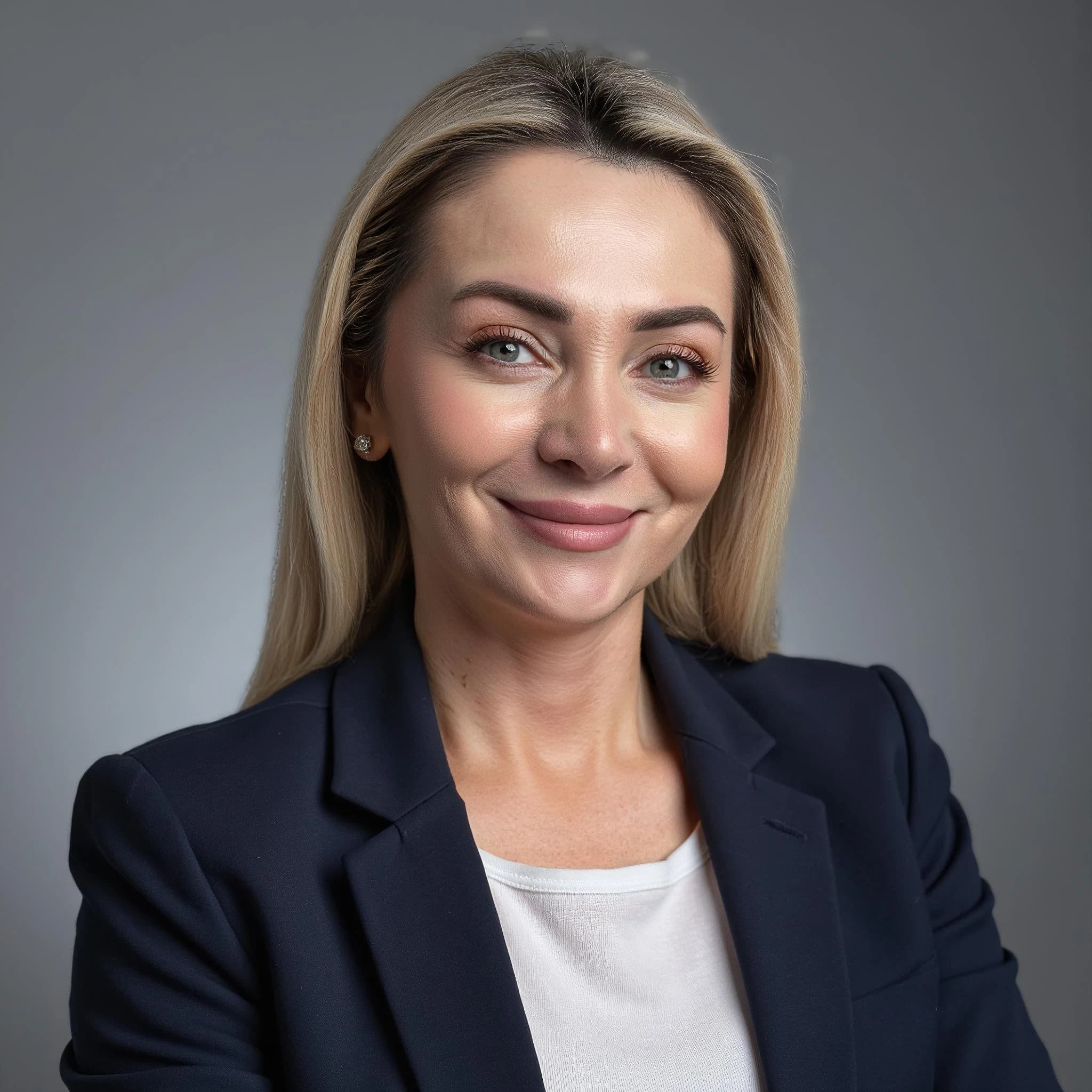 Professional headshot example: Woman Studio Blazer Smiling Headshot — LinkedInHeadshots.ai