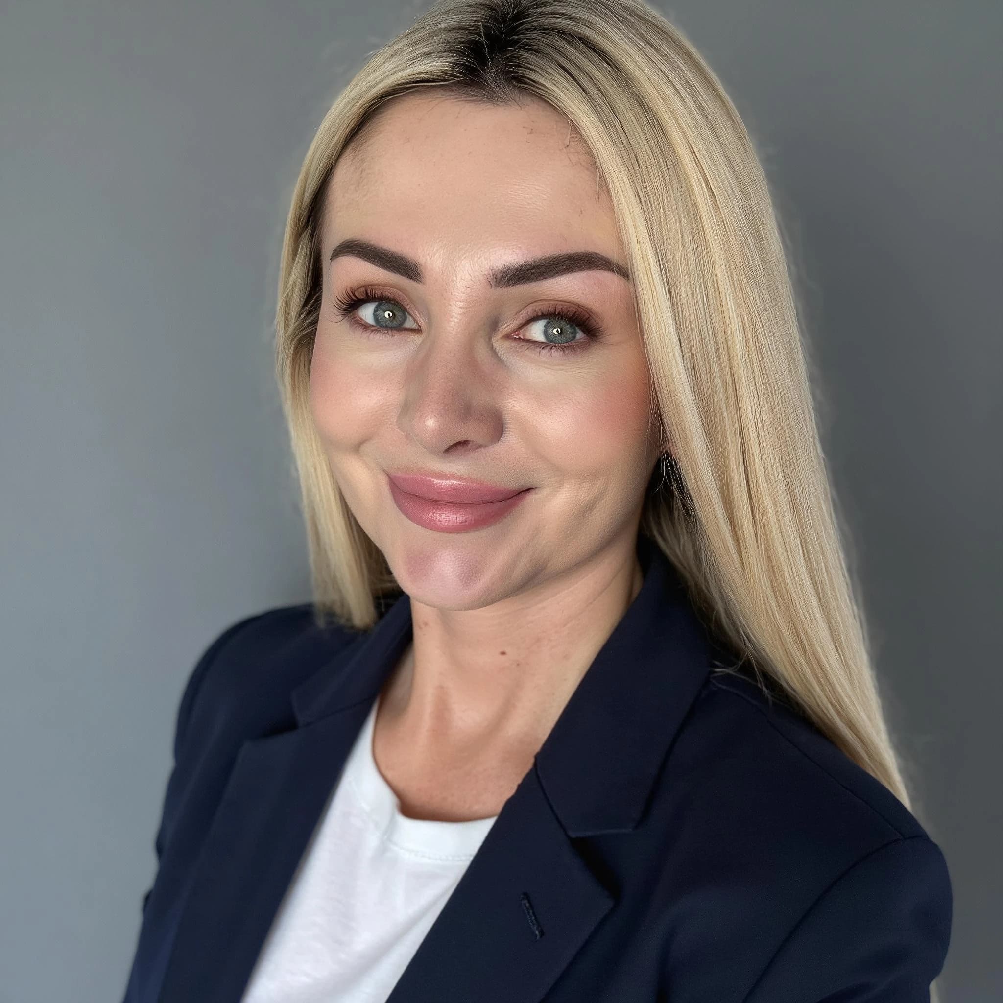 Professional headshot example: Woman Studio Blazer Smiling Headshot 2 — LinkedInHeadshots.ai