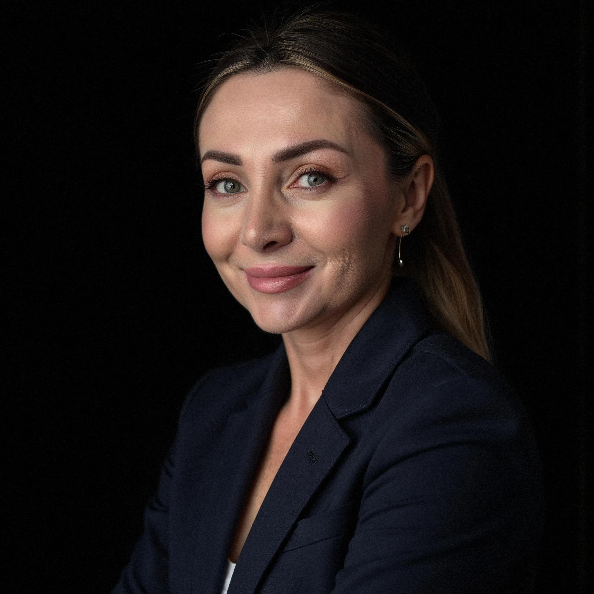 Professional headshot example: Woman Studio Navy Blazer Smiling 3 — LinkedInHeadshots.ai