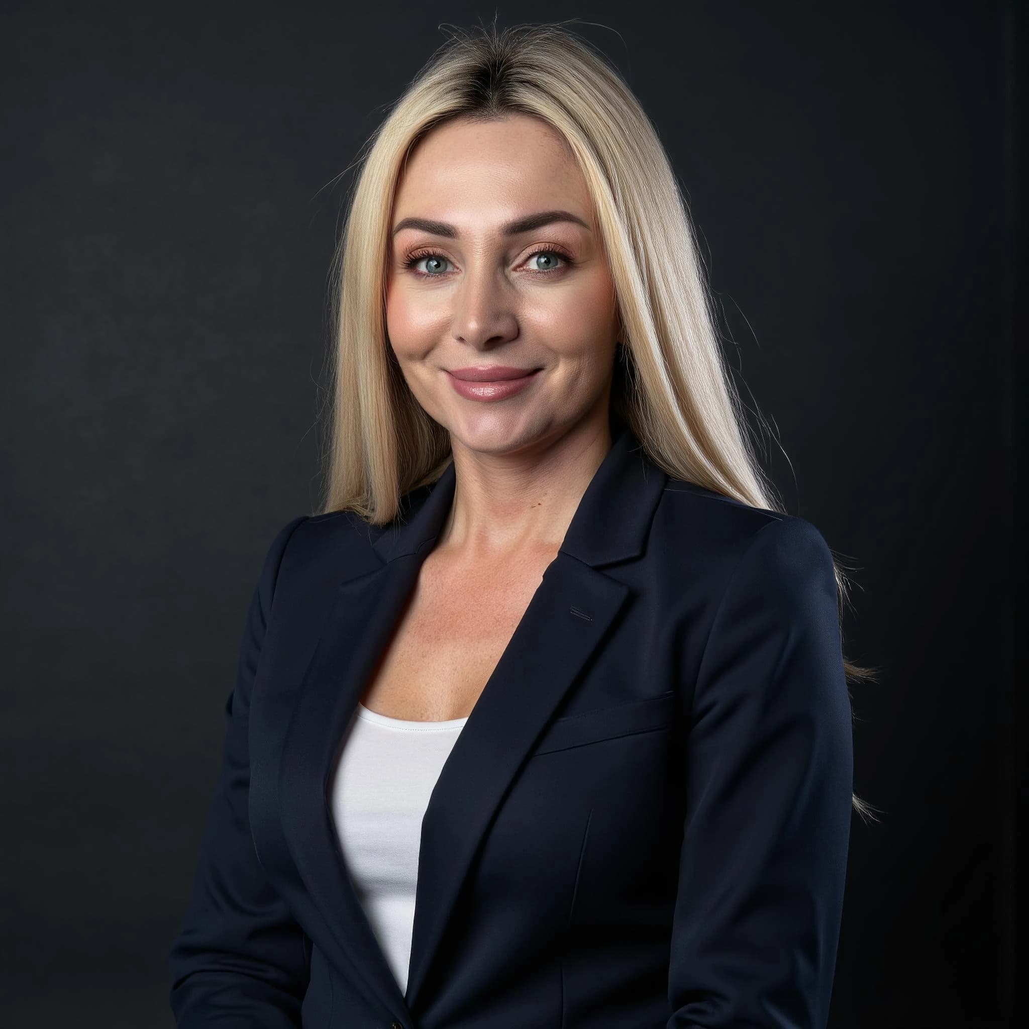 Professional headshot example: Woman Studio Navy Blazer Smiling 4 — LinkedInHeadshots.ai