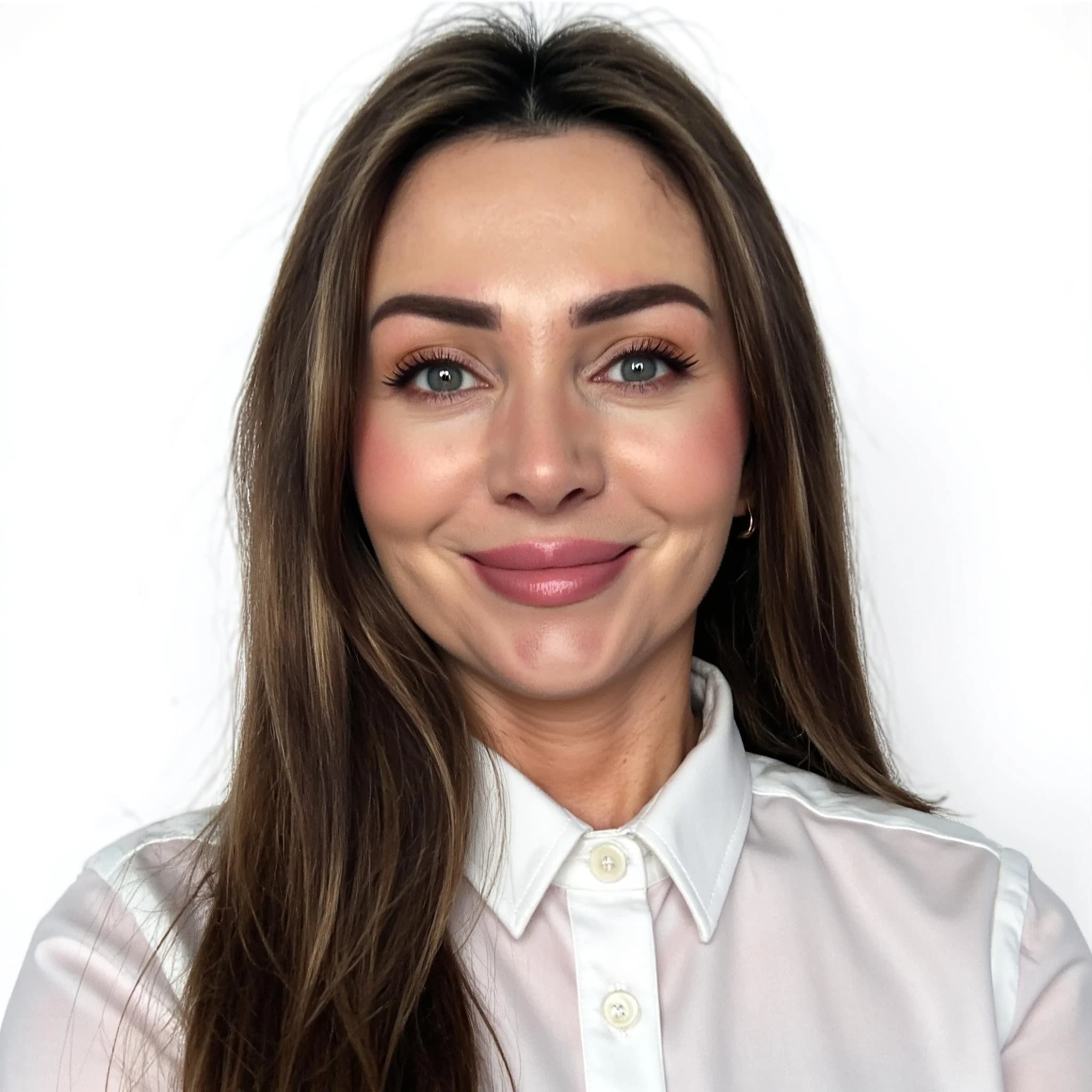Professional headshot example: Woman Studio White Shirt Smiling 2 — LinkedInHeadshots.ai
