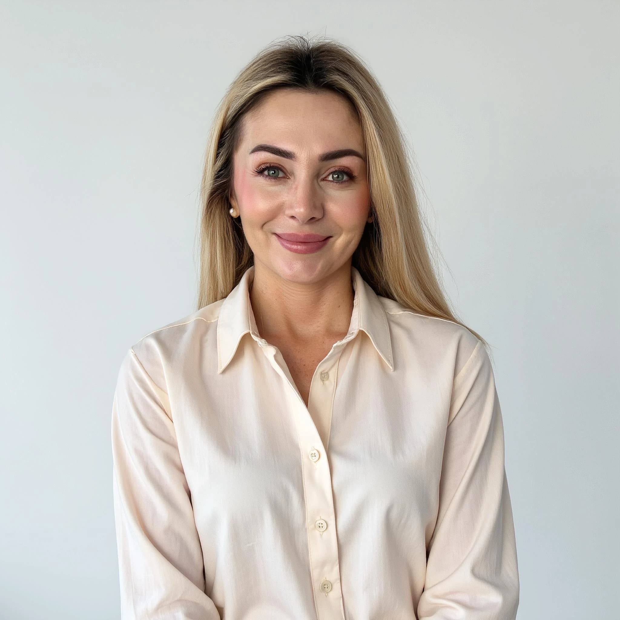 Professional headshot example: Woman Studio White Shirt Smiling 7 — LinkedInHeadshots.ai