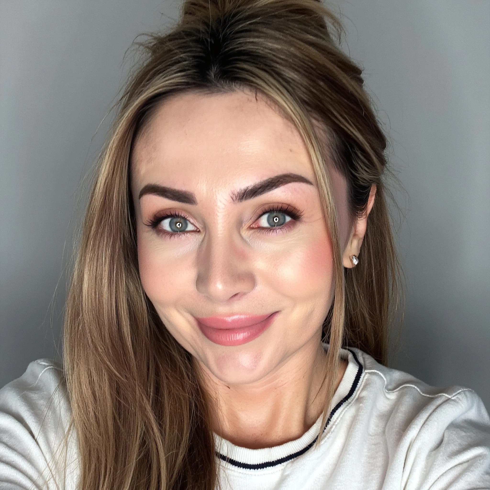 Professional headshot example: Woman Studio White Top Smiling 4 — LinkedInHeadshots.ai