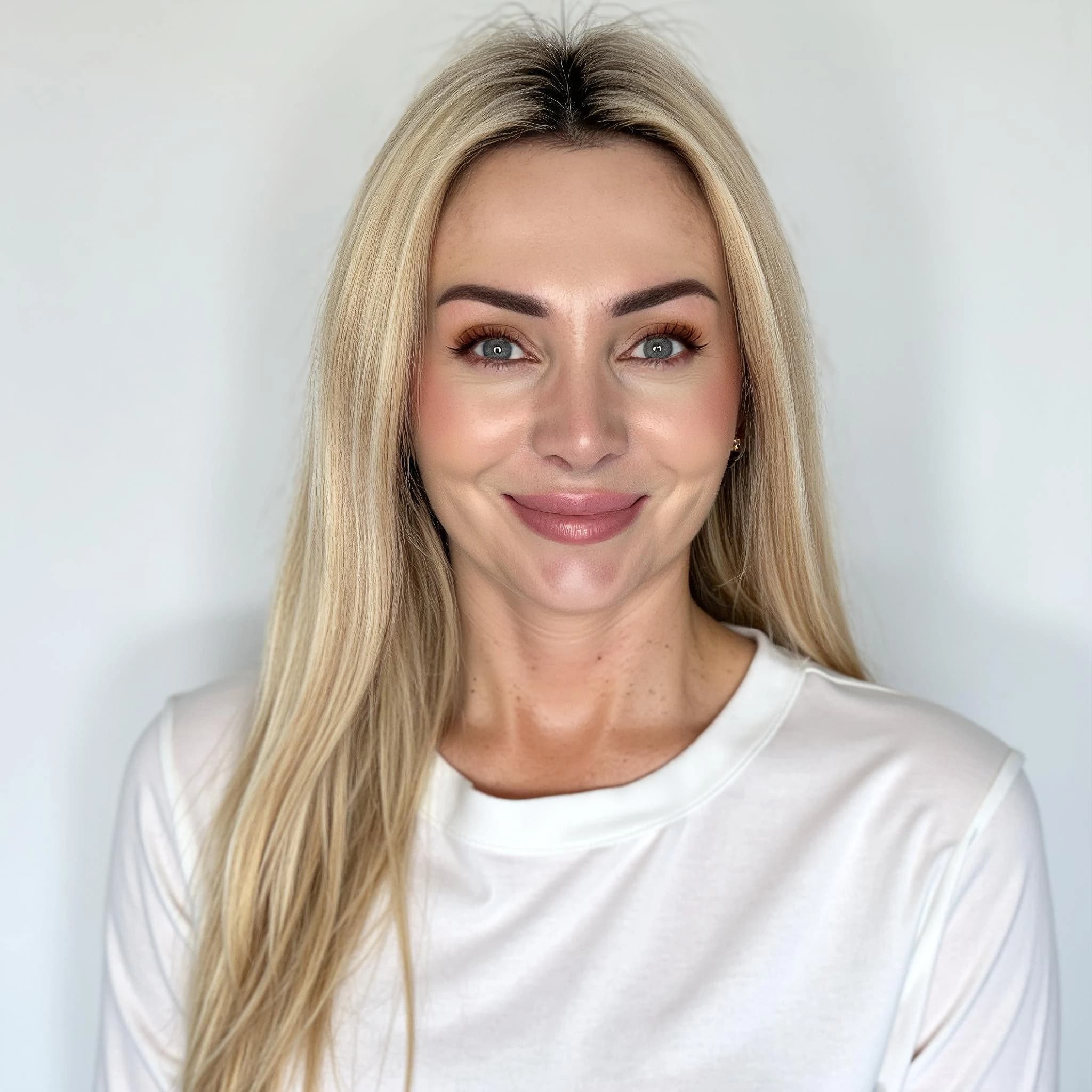 Professional headshot example: Woman Studio White Top Smiling 7 — LinkedInHeadshots.ai