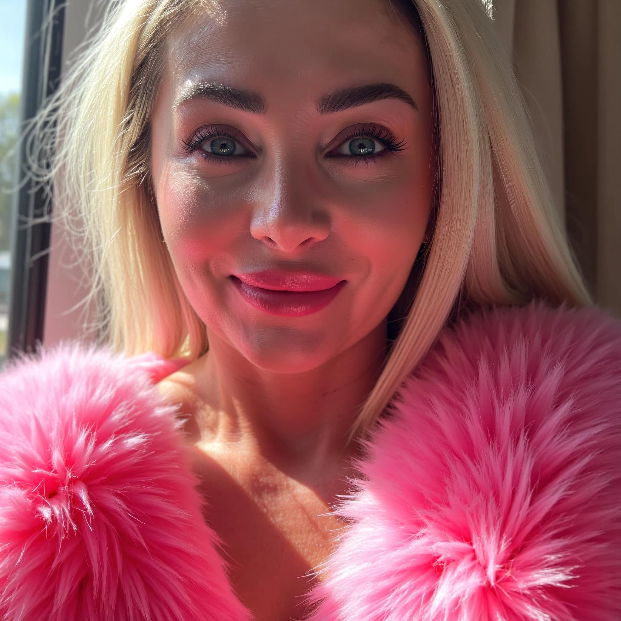 Professional headshot example: Woman Window Pink Fur Smiling — LinkedInHeadshots.ai
